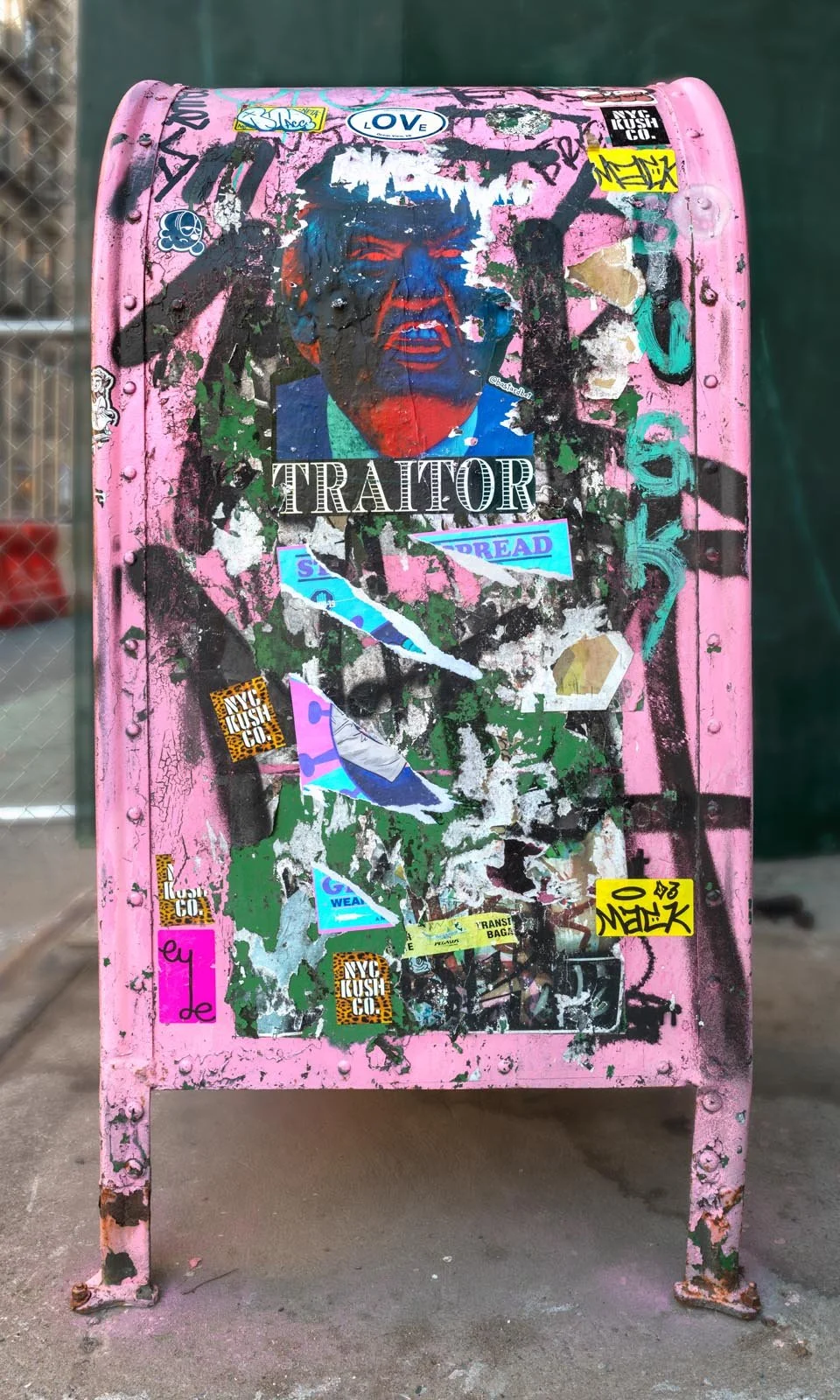 Fine art urban photography print of a public New York City mailbox covered in sticker slaps and graffiti. This photograph of street art collage is captured by contemporary photographer Barton Lewis.