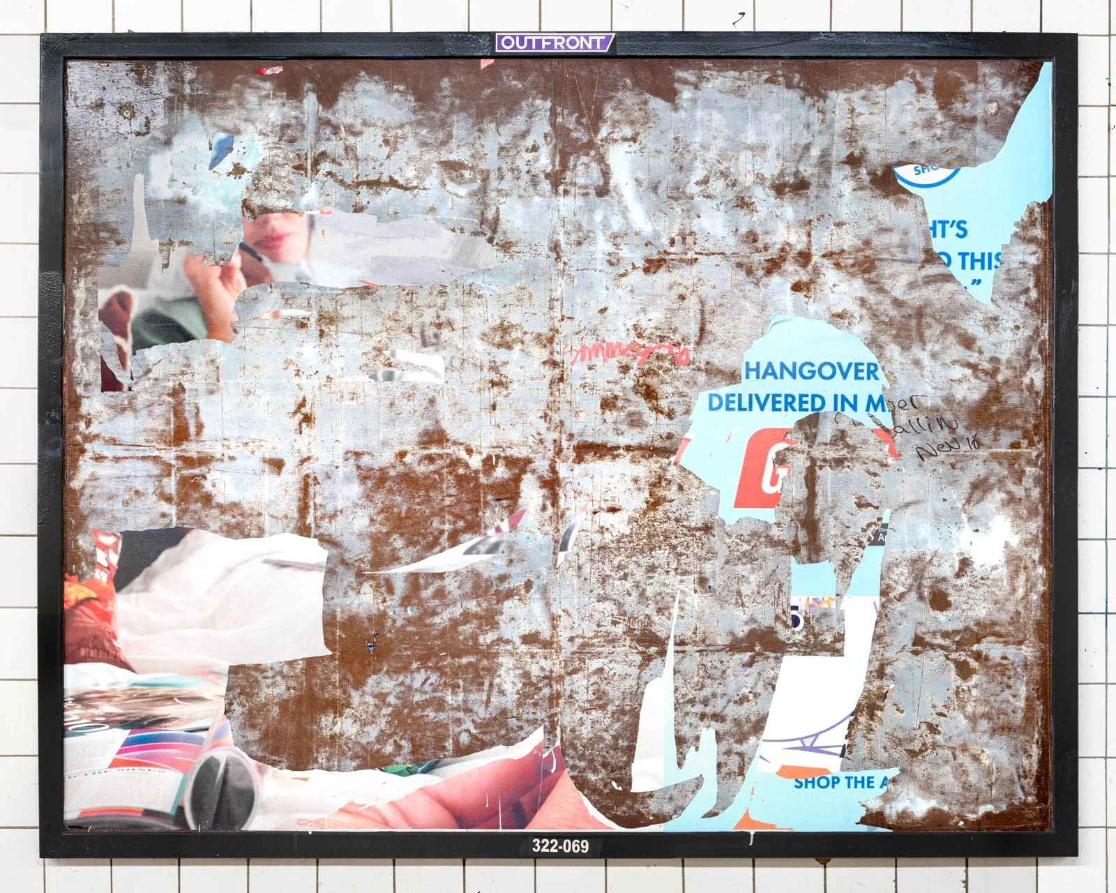 A photograph of a New York City subway advertising panel, containing posters torn by street artists and subway riders to create collage-like compositions.  Shot by Barton Lewis, capturing continuously mutating surfaces transformed into art by street 