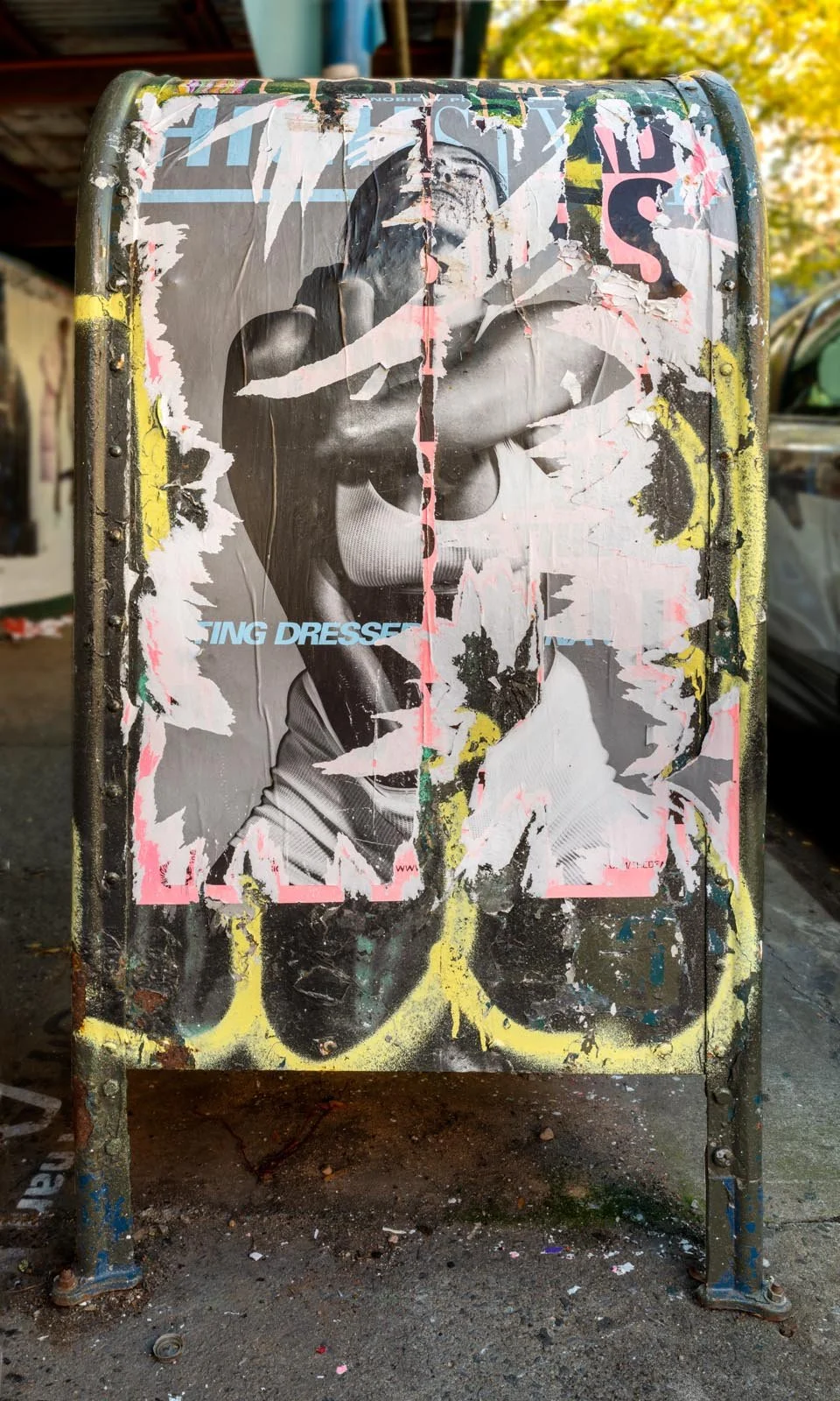Fine art urban photography print of a public New York City mailbox covered in sticker slaps and graffiti. This photograph of street art collage is captured by contemporary photographer Barton Lewis.