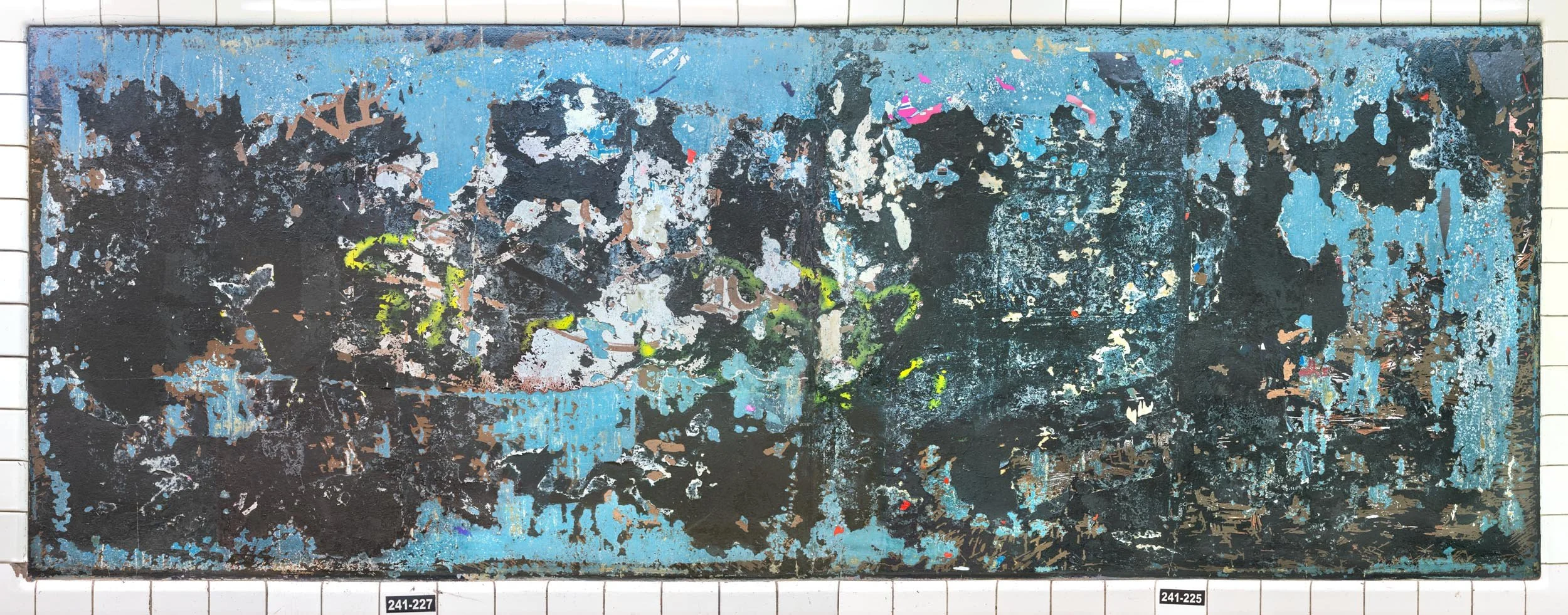 A photograph of a New York City subway advertising panel, showcasing urban decay transformed into fine art. Photographed by Barton Lewis, the image focuses on minimalist, painterly textures, poster fragments, heavily scraped surfaces and faded pigmen