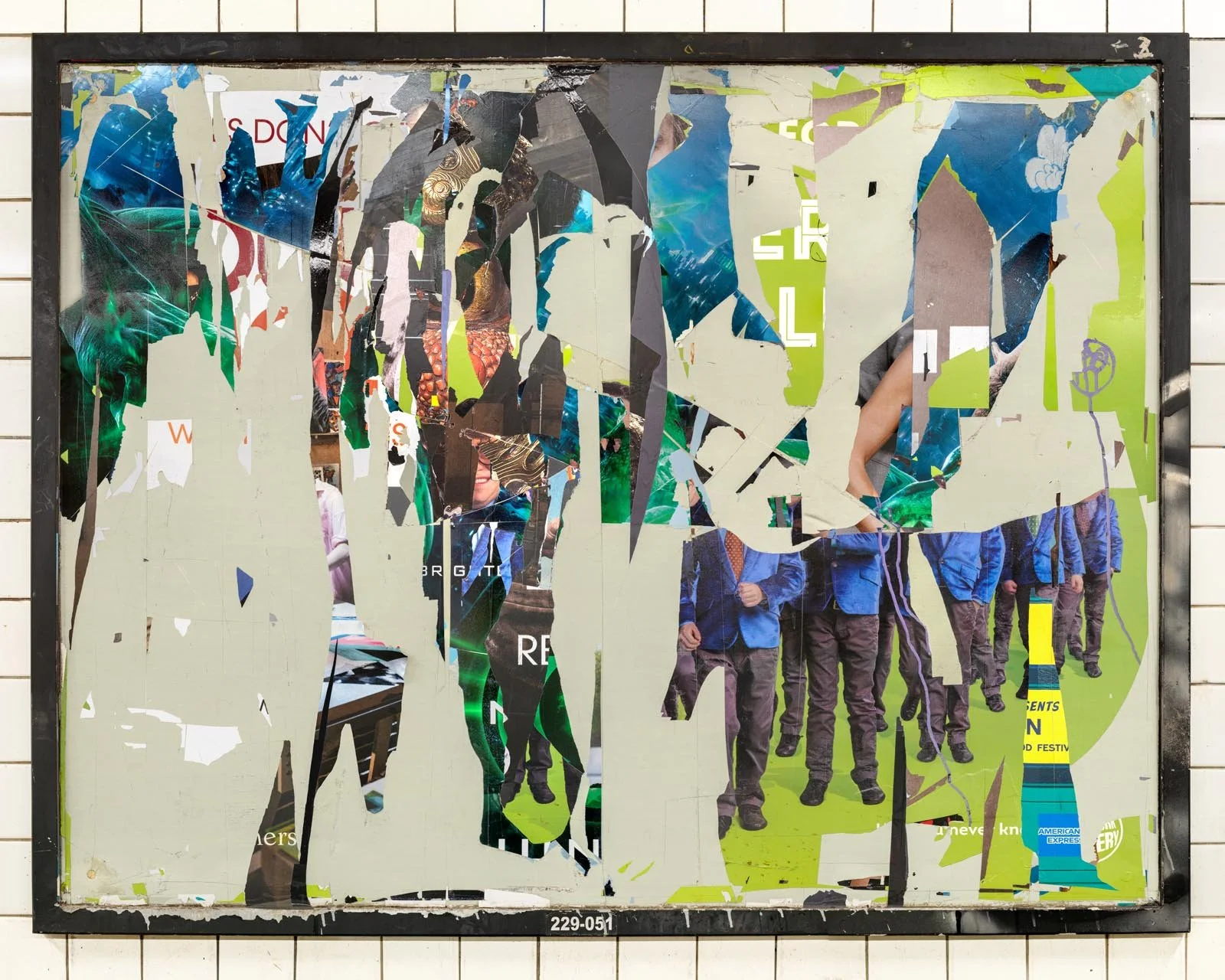 A photograph of a New York City subway advertising panel, containing posters torn by street artists and subway riders to create collage-like compositions.  Shot by Barton Lewis, capturing continuously mutating surfaces transformed into art by street 