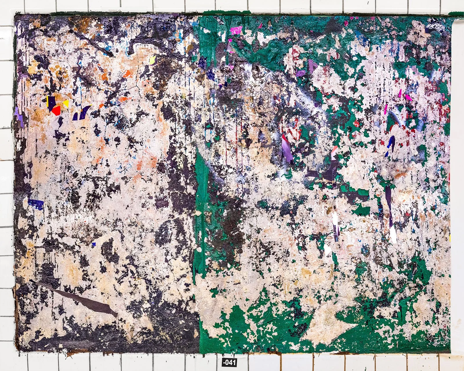 A photograph of a New York City subway advertising panel, showcasing urban decay transformed into fine art. Photographed by Barton Lewis, the image focuses on minimalist, painterly textures, poster fragments, heavily scraped surfaces and faded pigmen