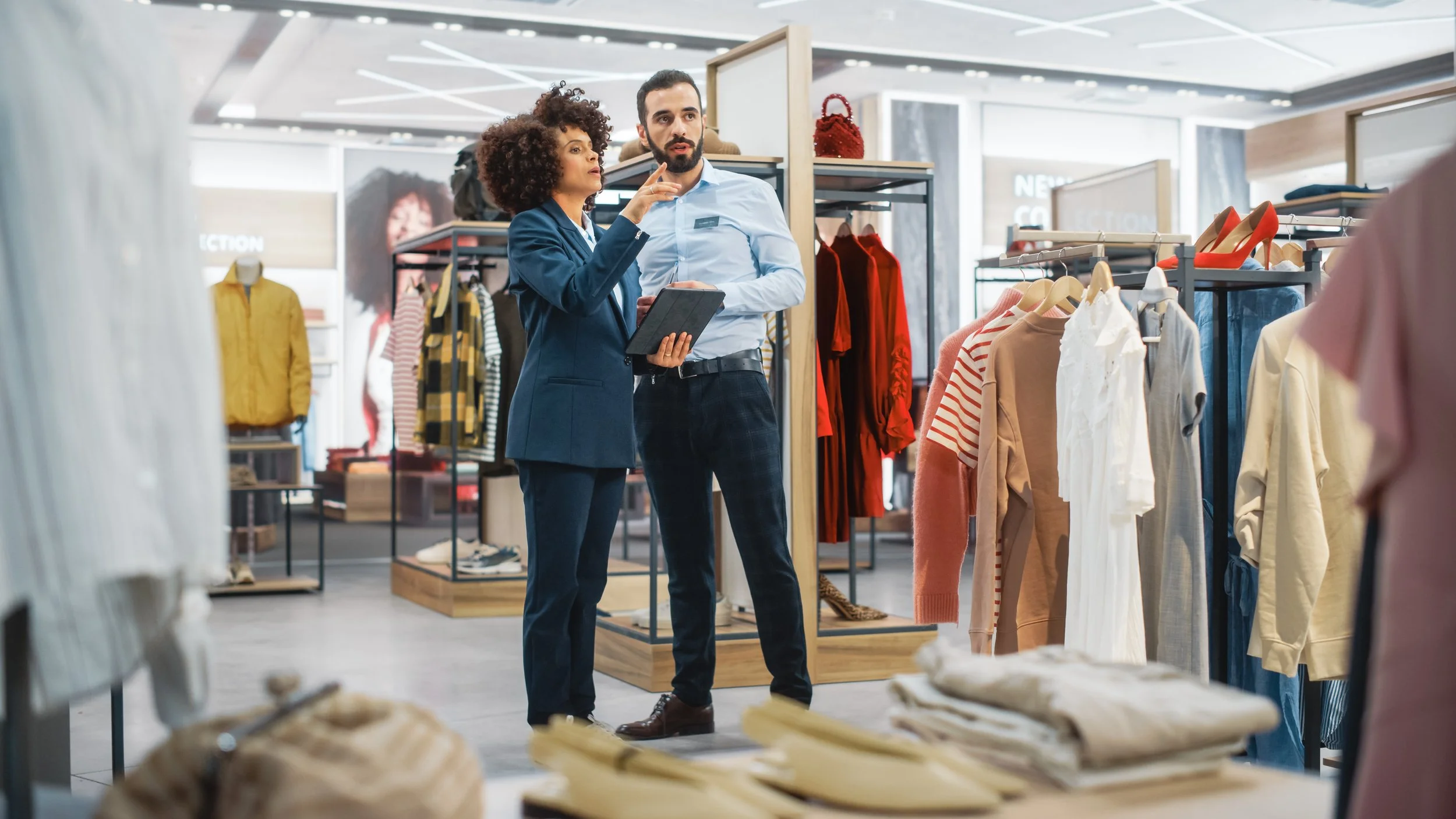 A man and a woman having a discussion in a retail store