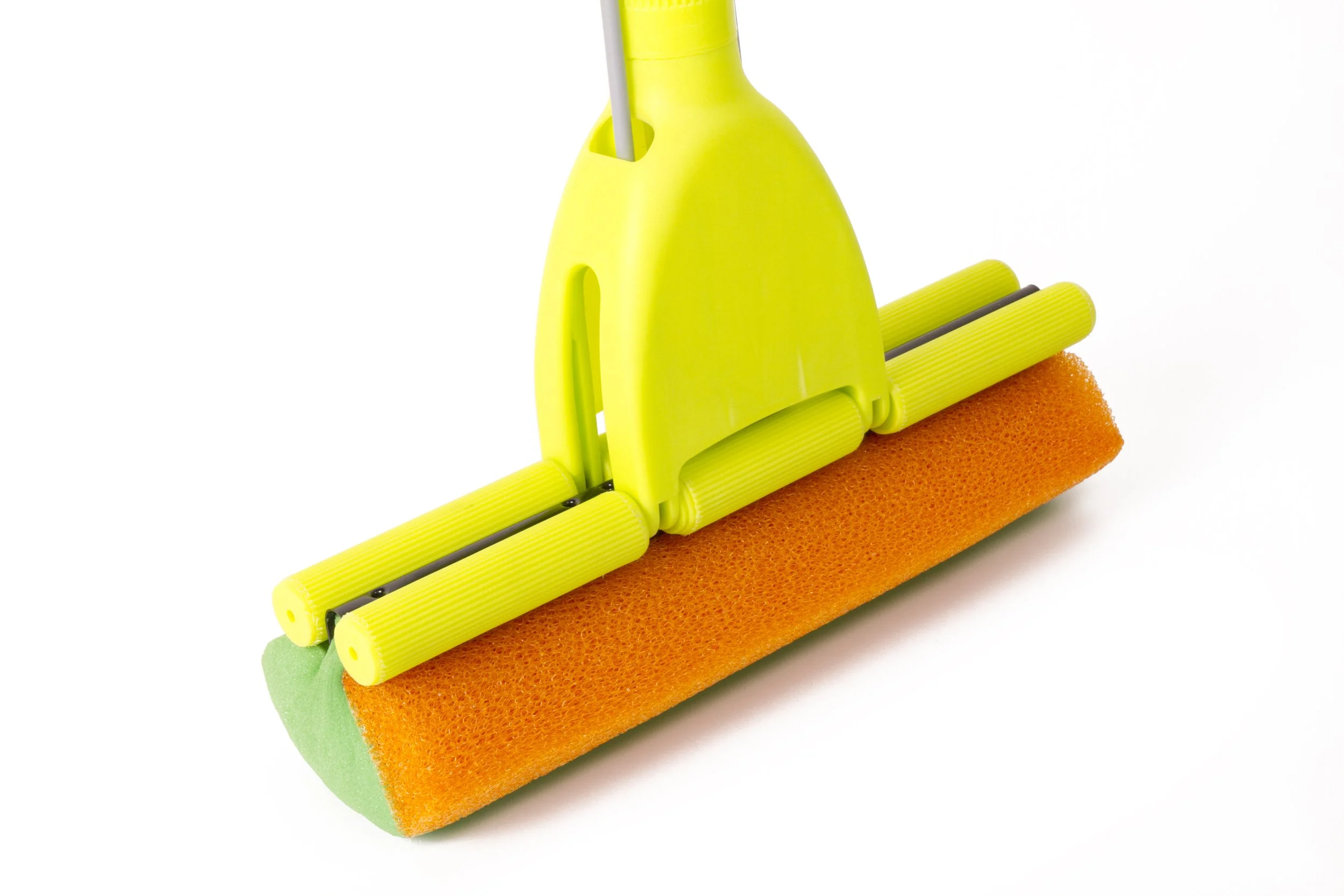 A yellow and orange sponge squeegee with a green handle and a yellow plastic part on top.