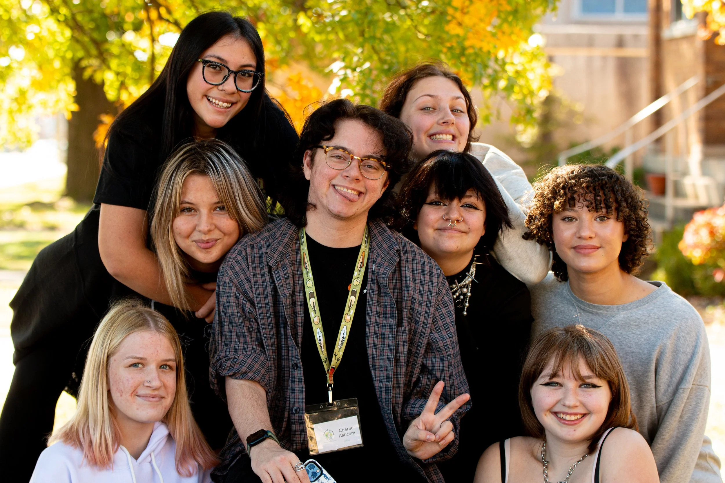 Group of elementary students posing together outdoors for class photo on picture day