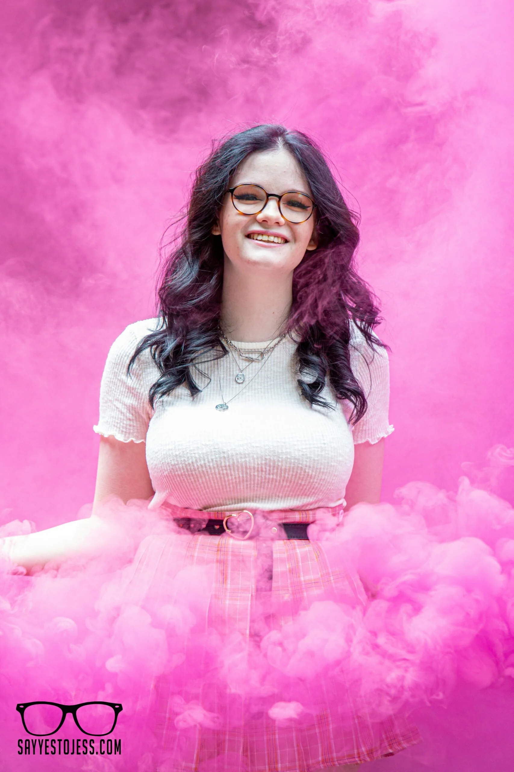 Bold senior portrait with smoke bomb effects and dramatic color during a senior photo session by Say Yes to Jess