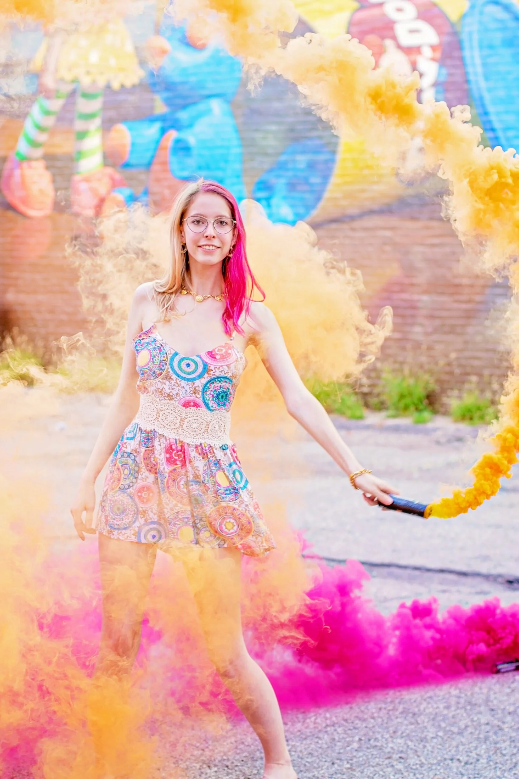 Senior portrait with colorful smoke bombs creating a dramatic cinematic effect during a creative session in Cincinnati