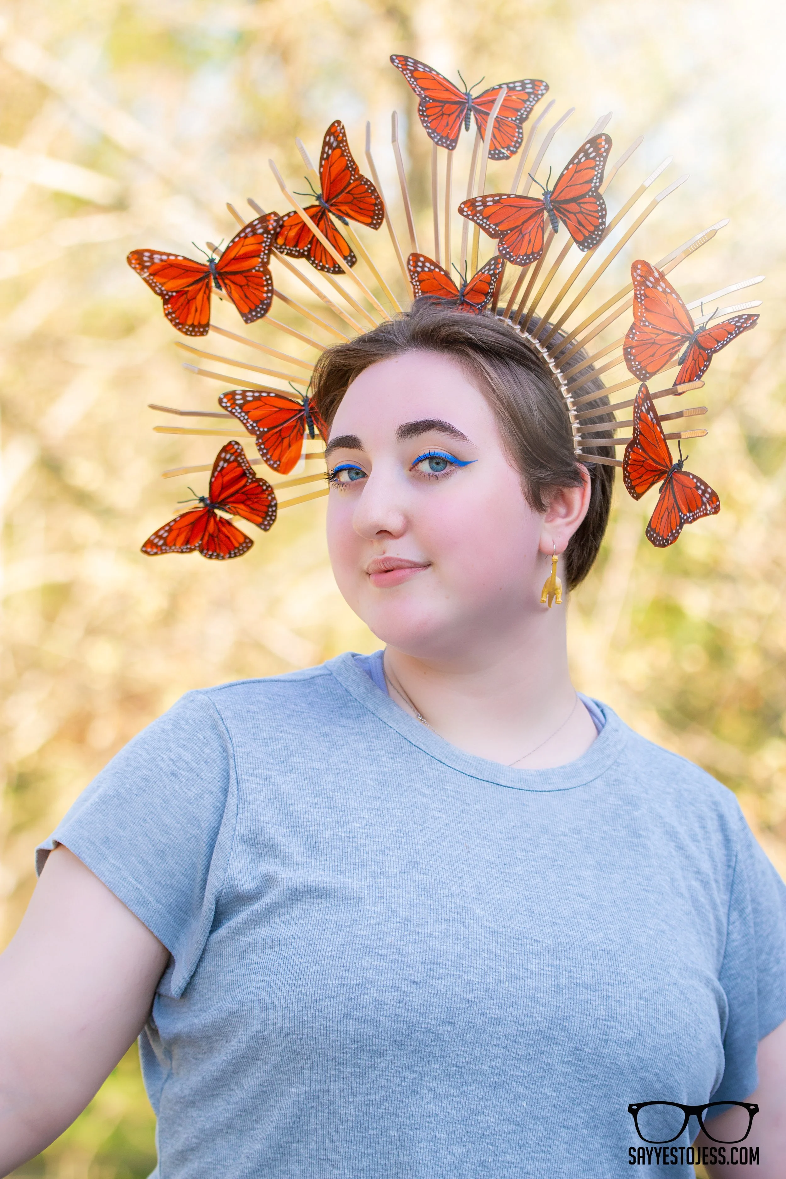 Senior portrait of a young woman wearing a butterfly crown during a creative styled senior session in Cincinnati Ohio