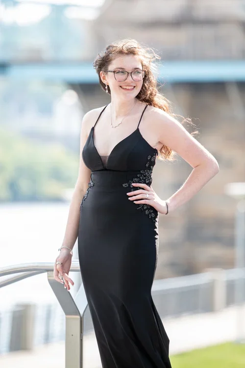 Senior smiling and having fun during a relaxed creative senior portrait session at Say Yes to Jess studio in Cincinnati