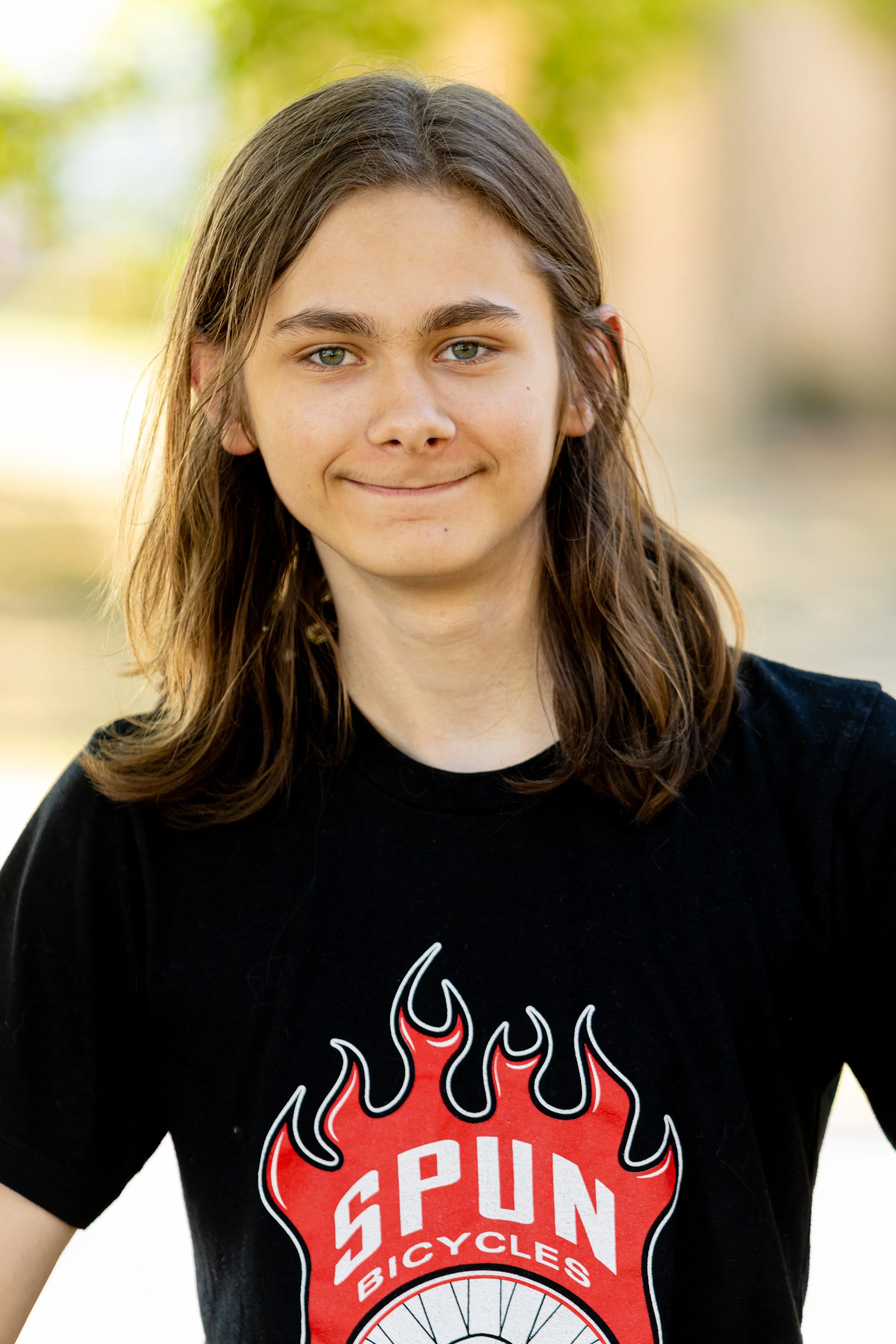Young student smiling for outdoor school portrait by Say Yes to Jess