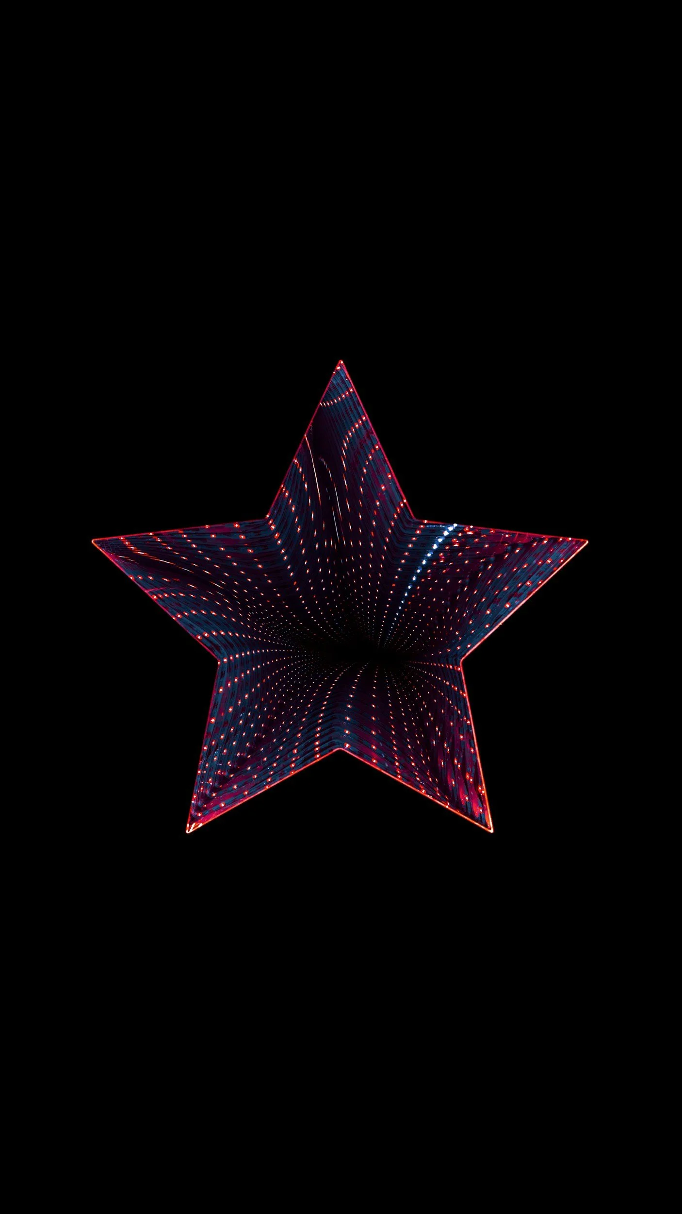 Geometric star shape with colorful, illuminated patterns on a black background.
