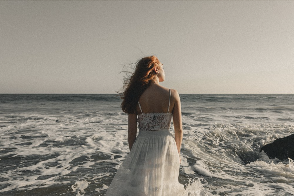 Bride looking out into the ocean