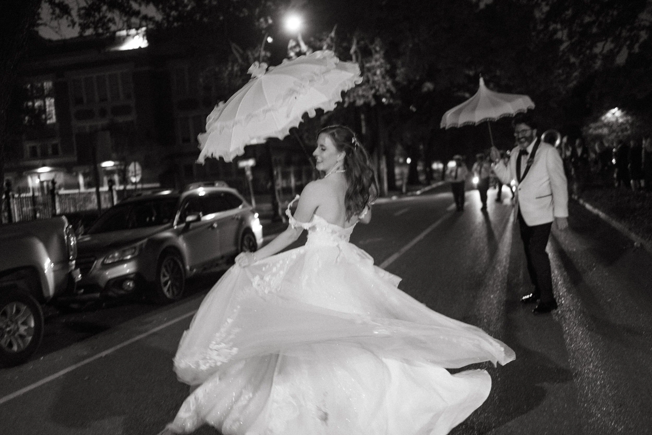 Bride and groom second lining through the streets of New Orleans