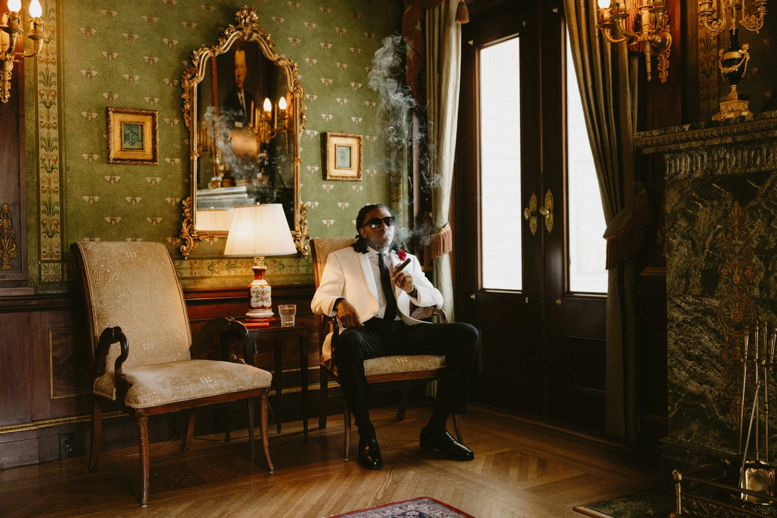 Groom sitting enjoying a cigar