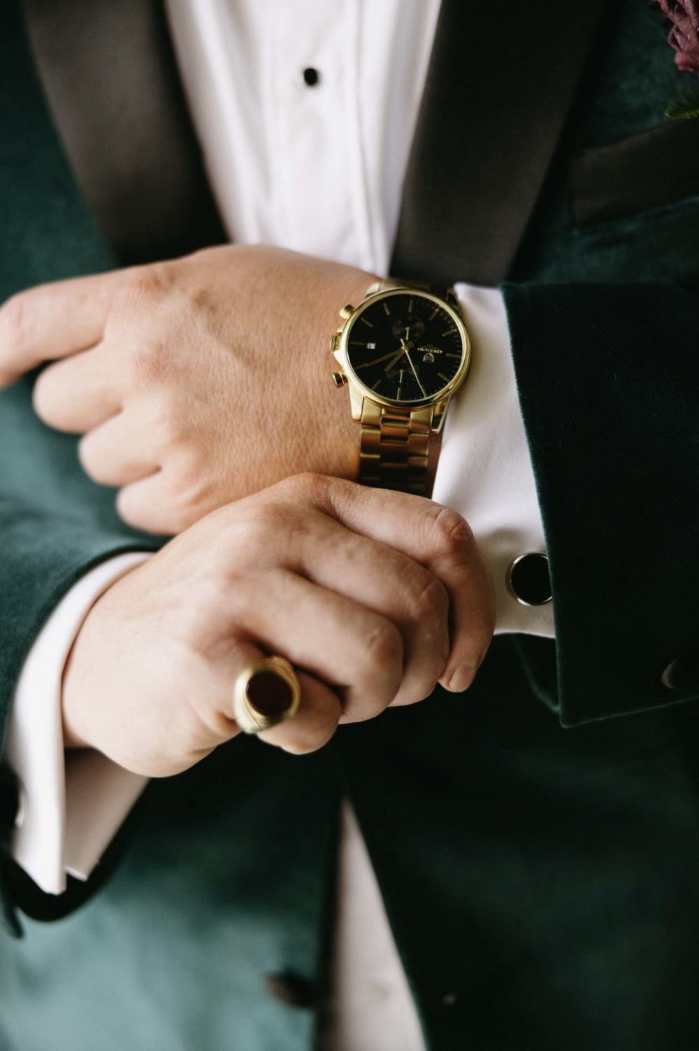 Groom adjusting his cufflinks