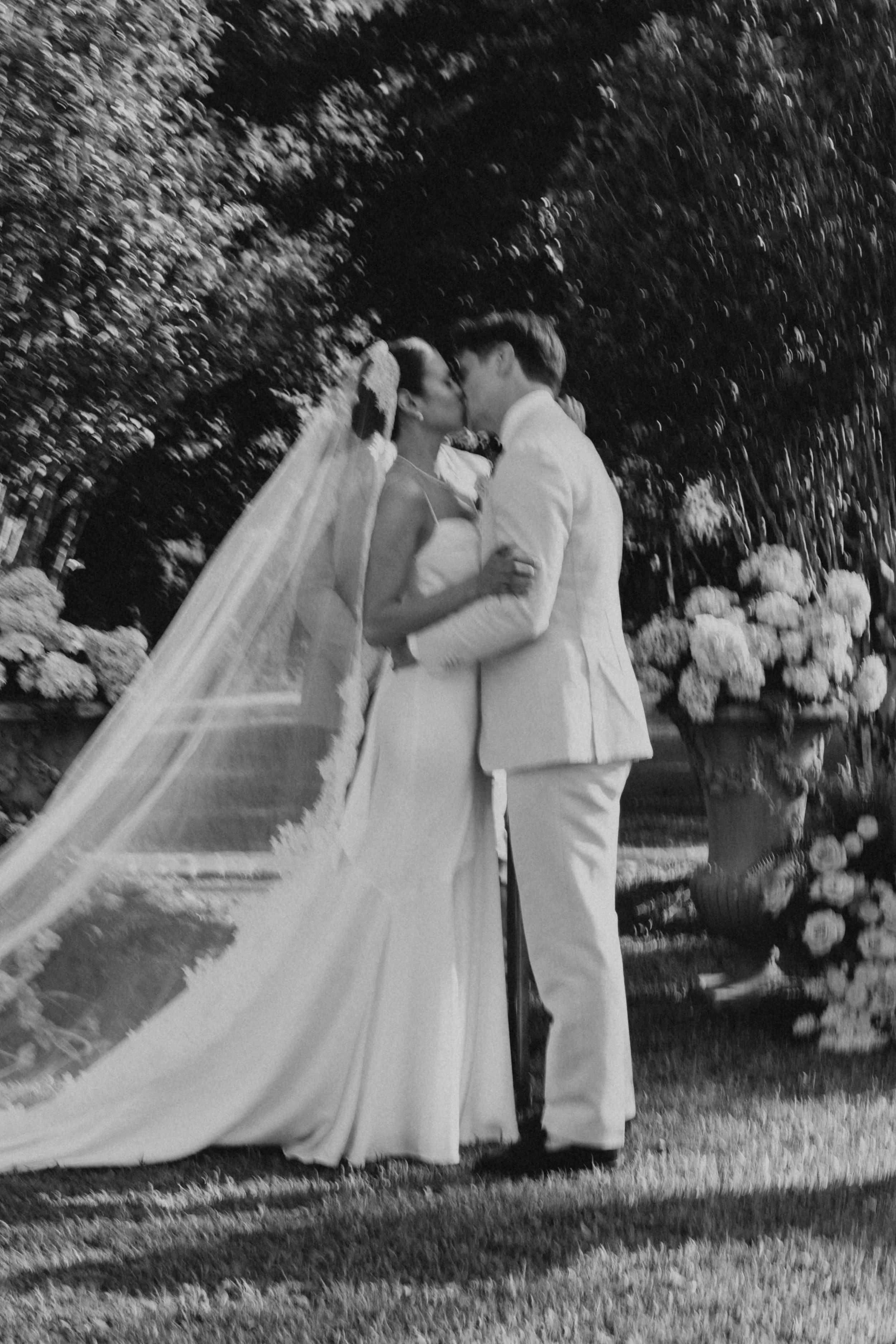 Bride and groom kissing at the altar