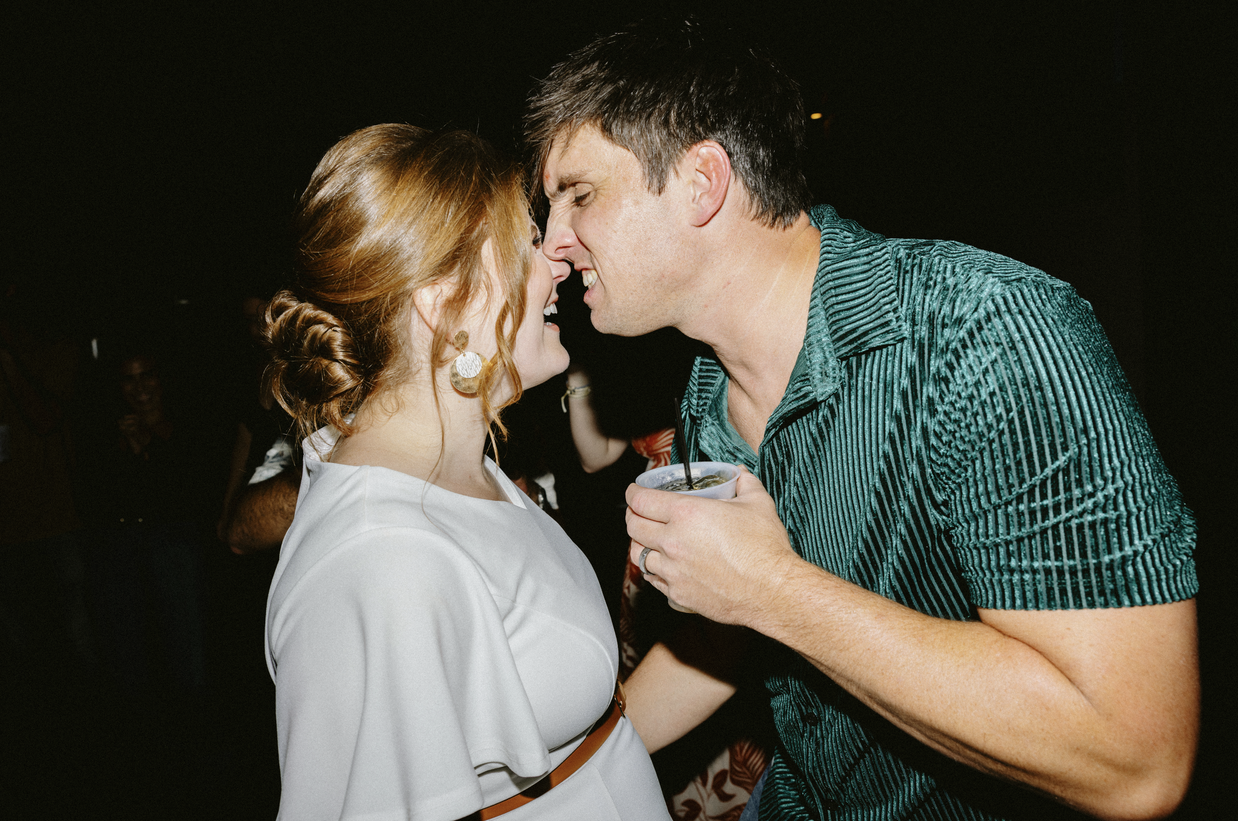 Bride and groom having fun at their reception
