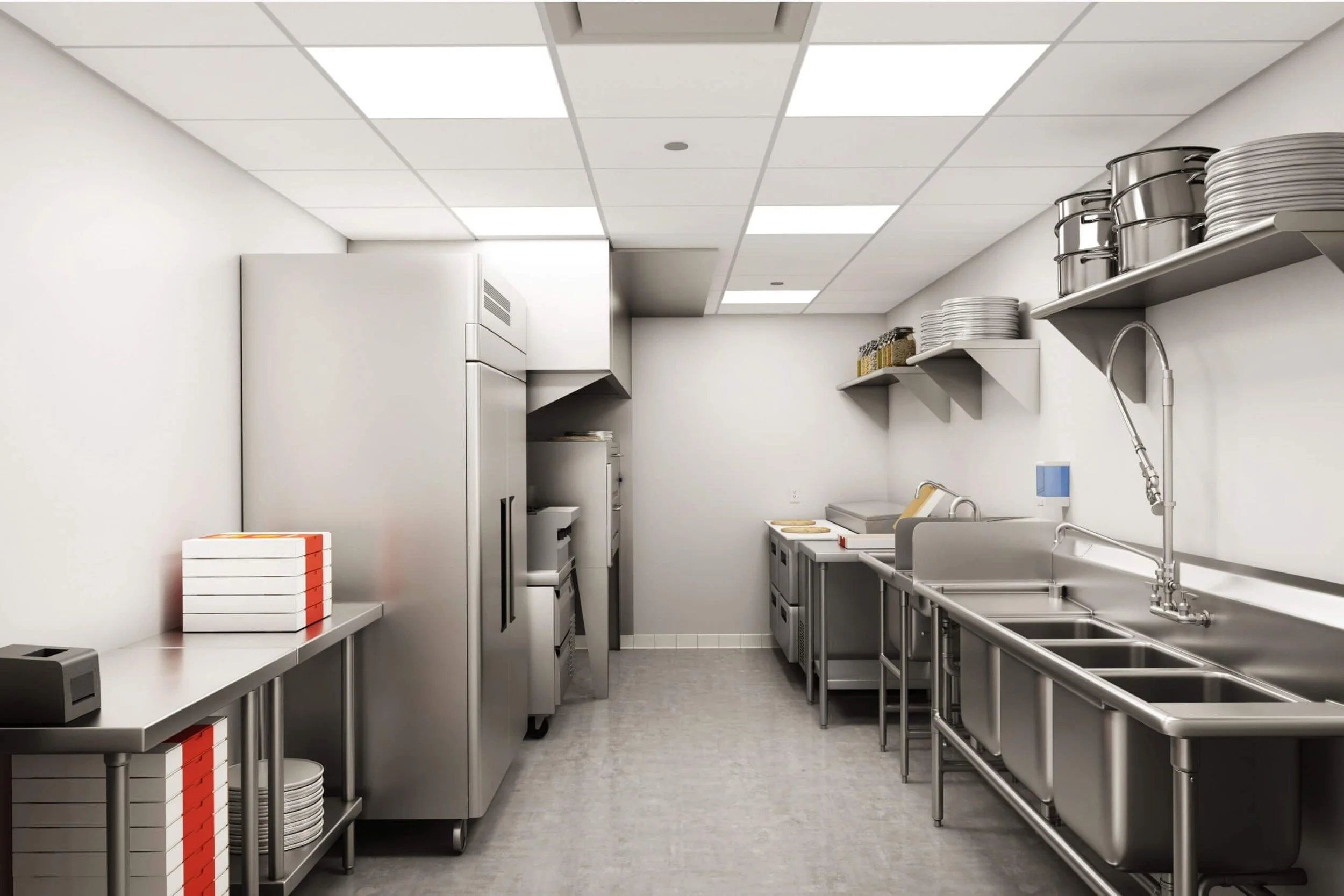 A clean commercial kitchen with stainless steel countertops, shelves, and appliances, including a refrigerator, sink, and stacks of plates and containers.