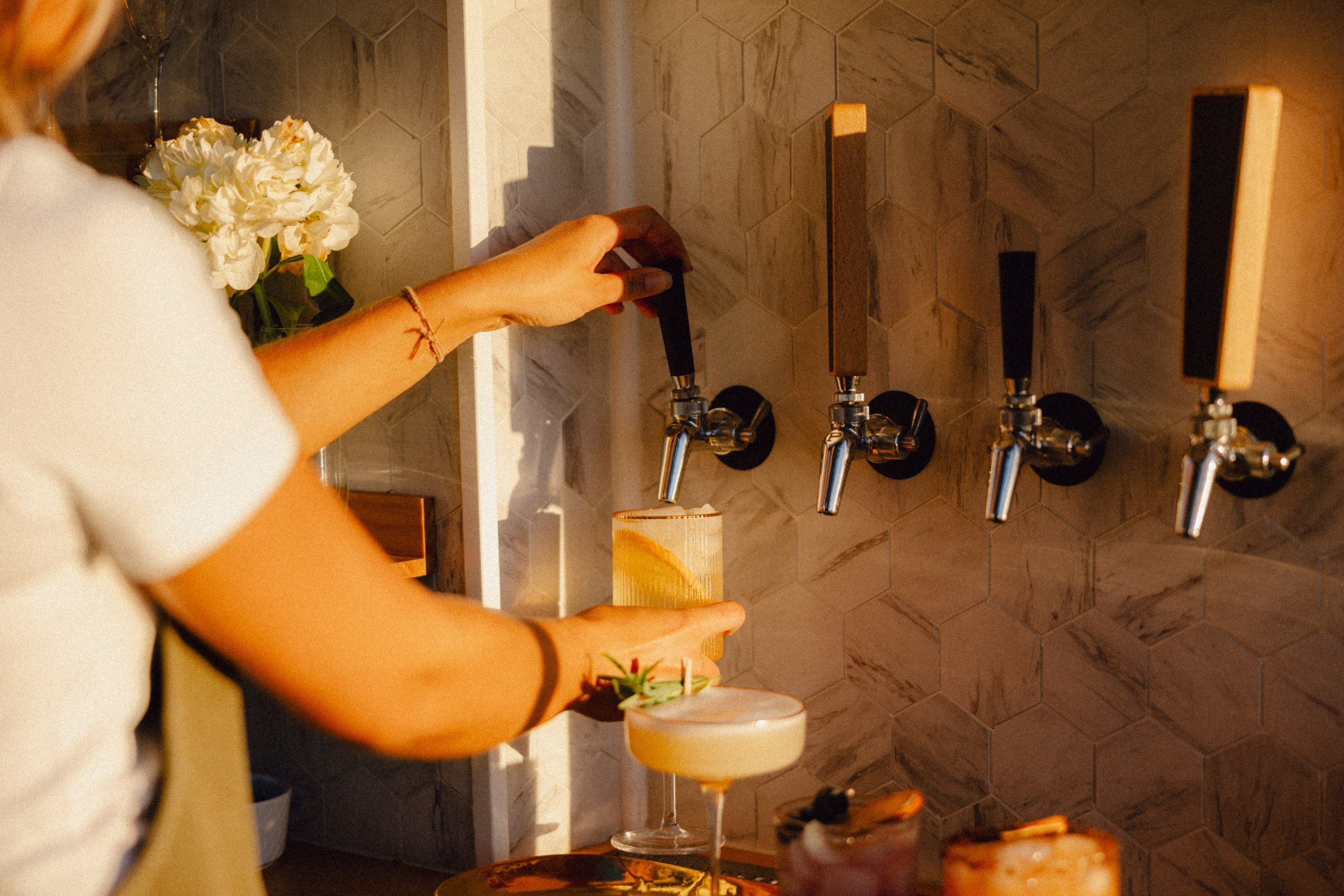 Coco has 4 taps for serving beverage: cocktails, beers, lemonade, cambucha, cold brew coffee and much more.
