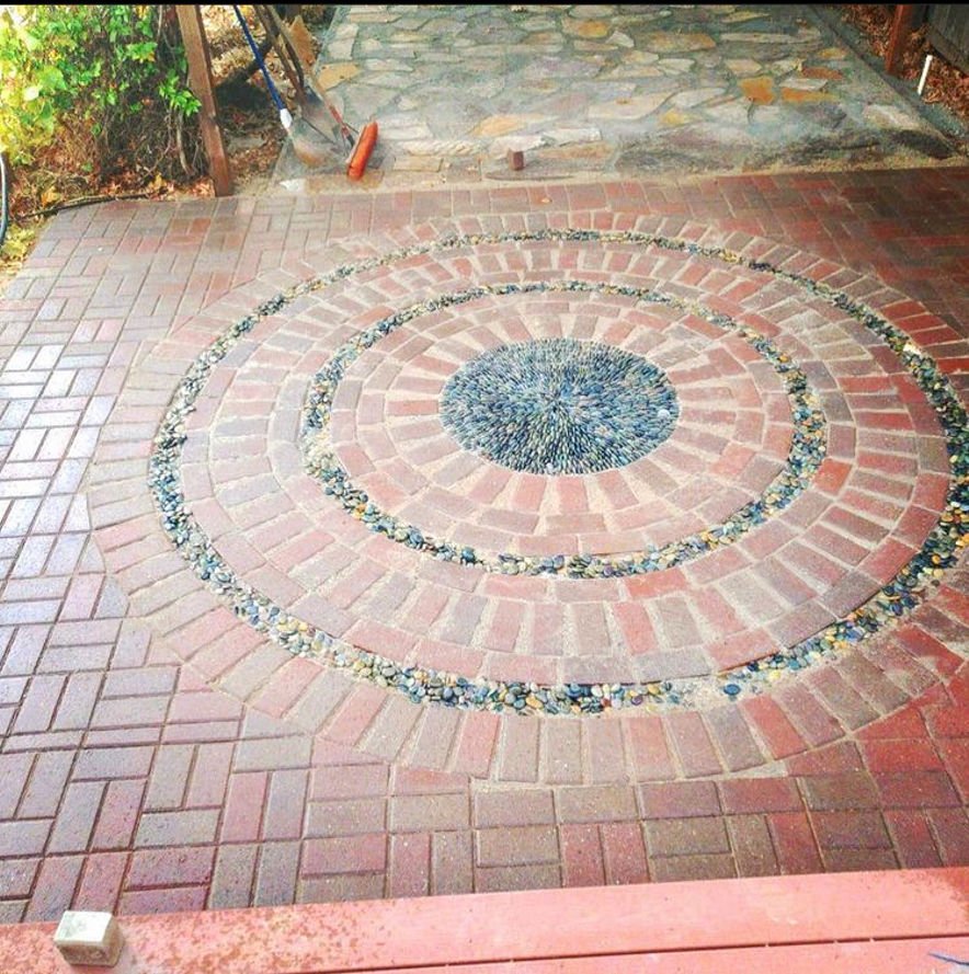 artistically designed ground details with bricks and small pebbles by Blue Moon Landscape