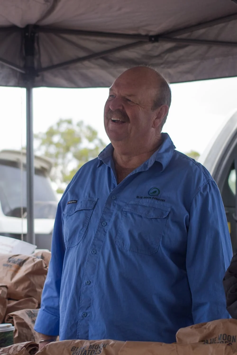Larry, owner of Blue Moon Potatoes, at farmer's market