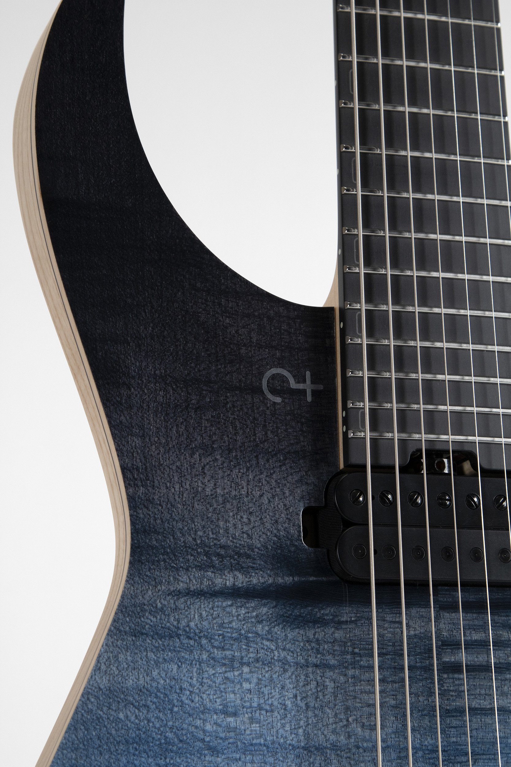 Black Richlite fretboard and pickups of the Infinia Ceres CE6606 7-string guitar