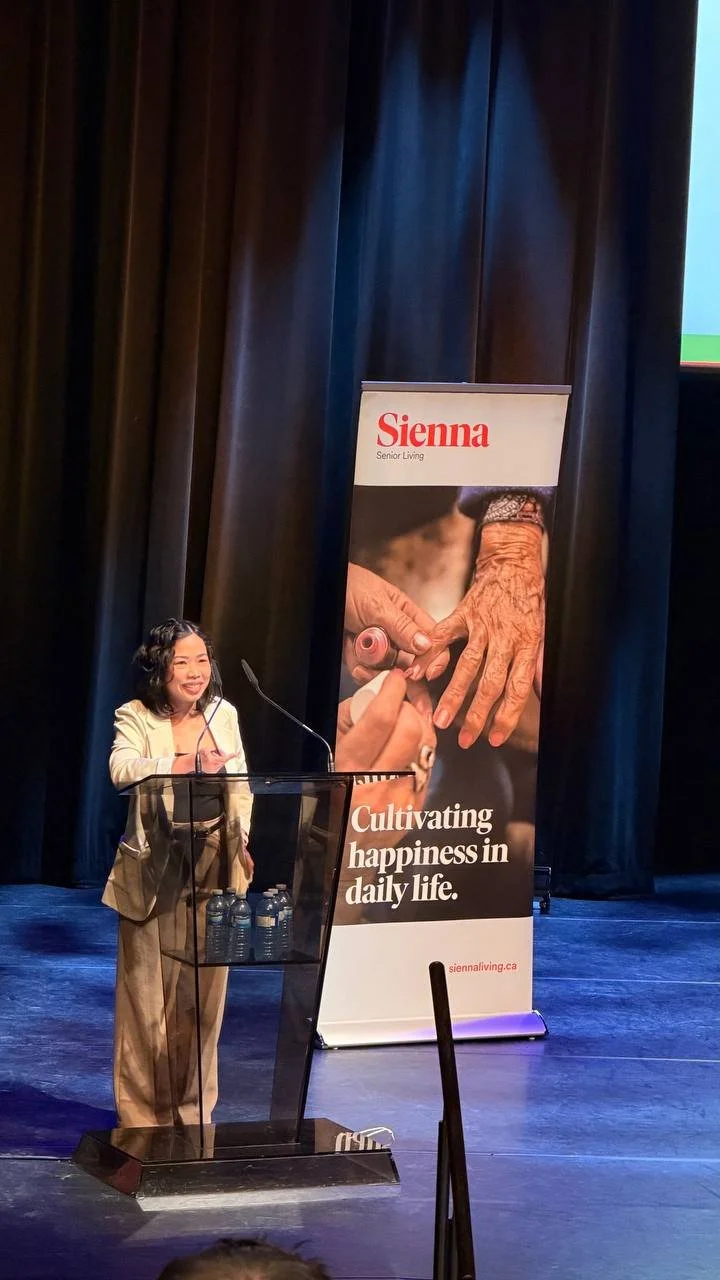 Elda Almario onstage speaking at Sienna Senior Living Town Hall at Flato Markham Theatre
