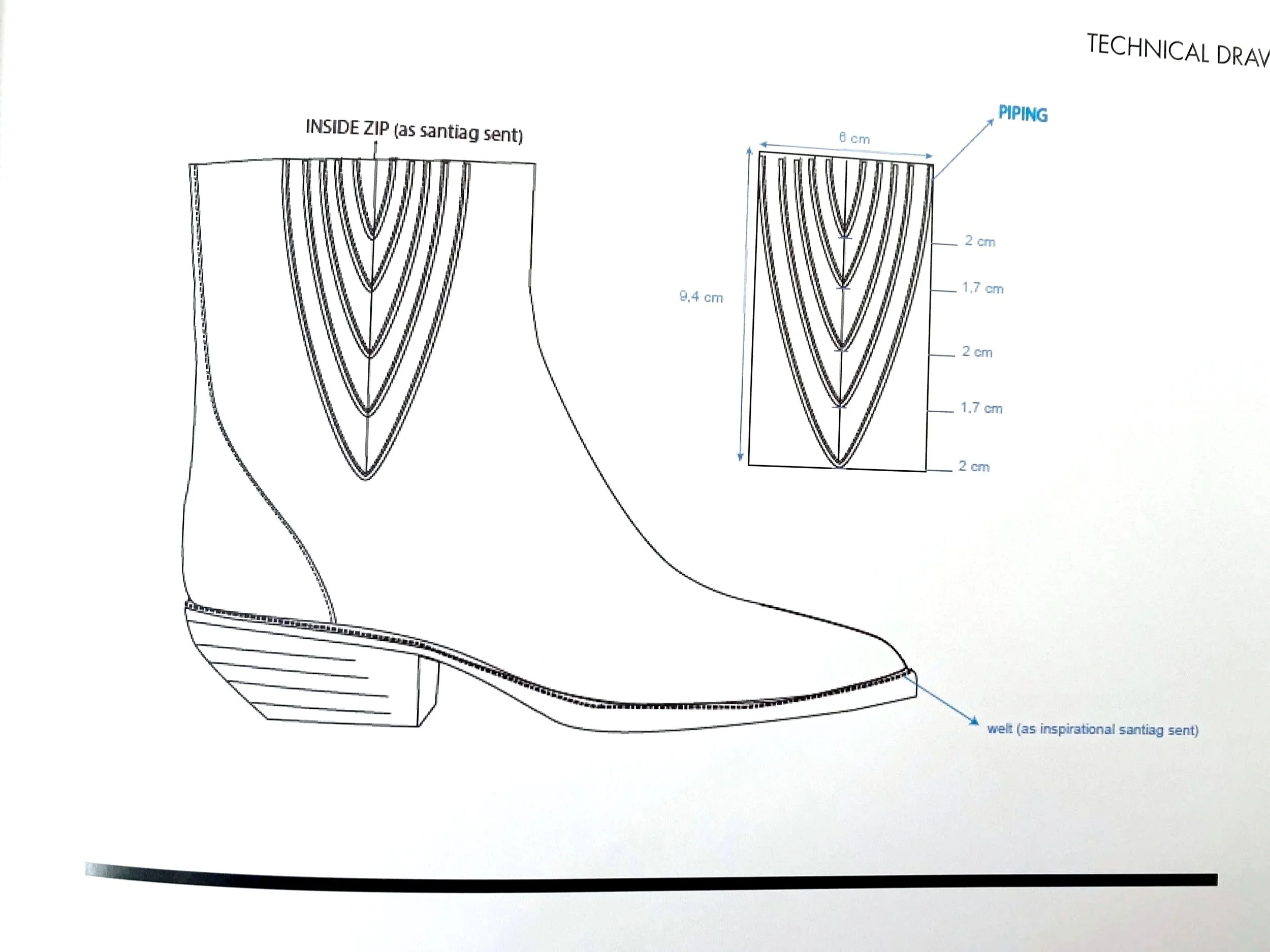 Technical piping detail on a leather Santiag boot. 