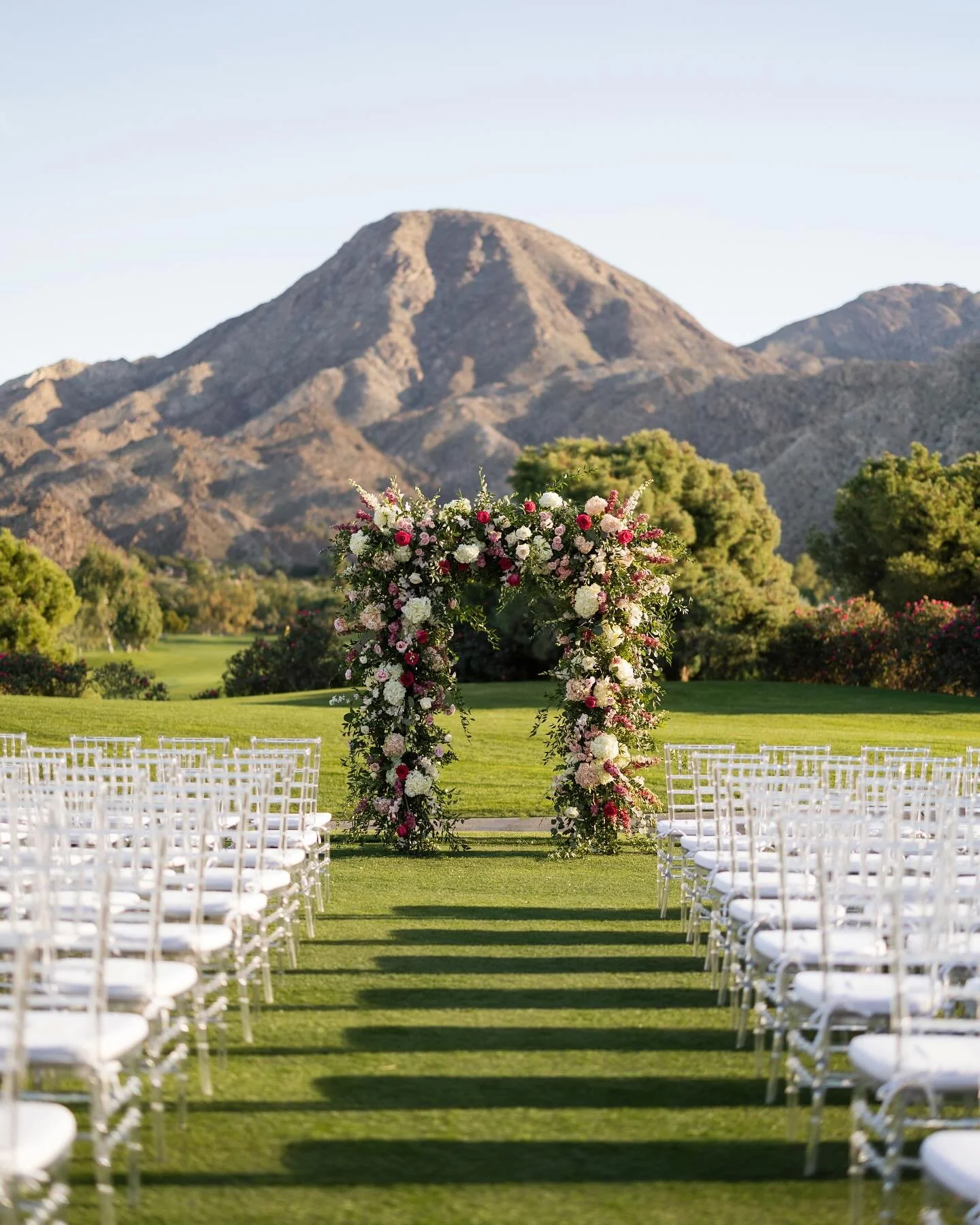 A well-designed ceremony considers more than florals, chairs, and an aisle&ndash;it frames the environment, highlights a natural setting, and is activated by lighting at the perfect time of the day.

Planning: @coj_events
Photography: @danforthneal
V