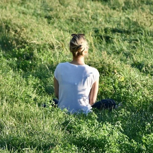 Person practicing self-regulation by using their senses in the outdoors.