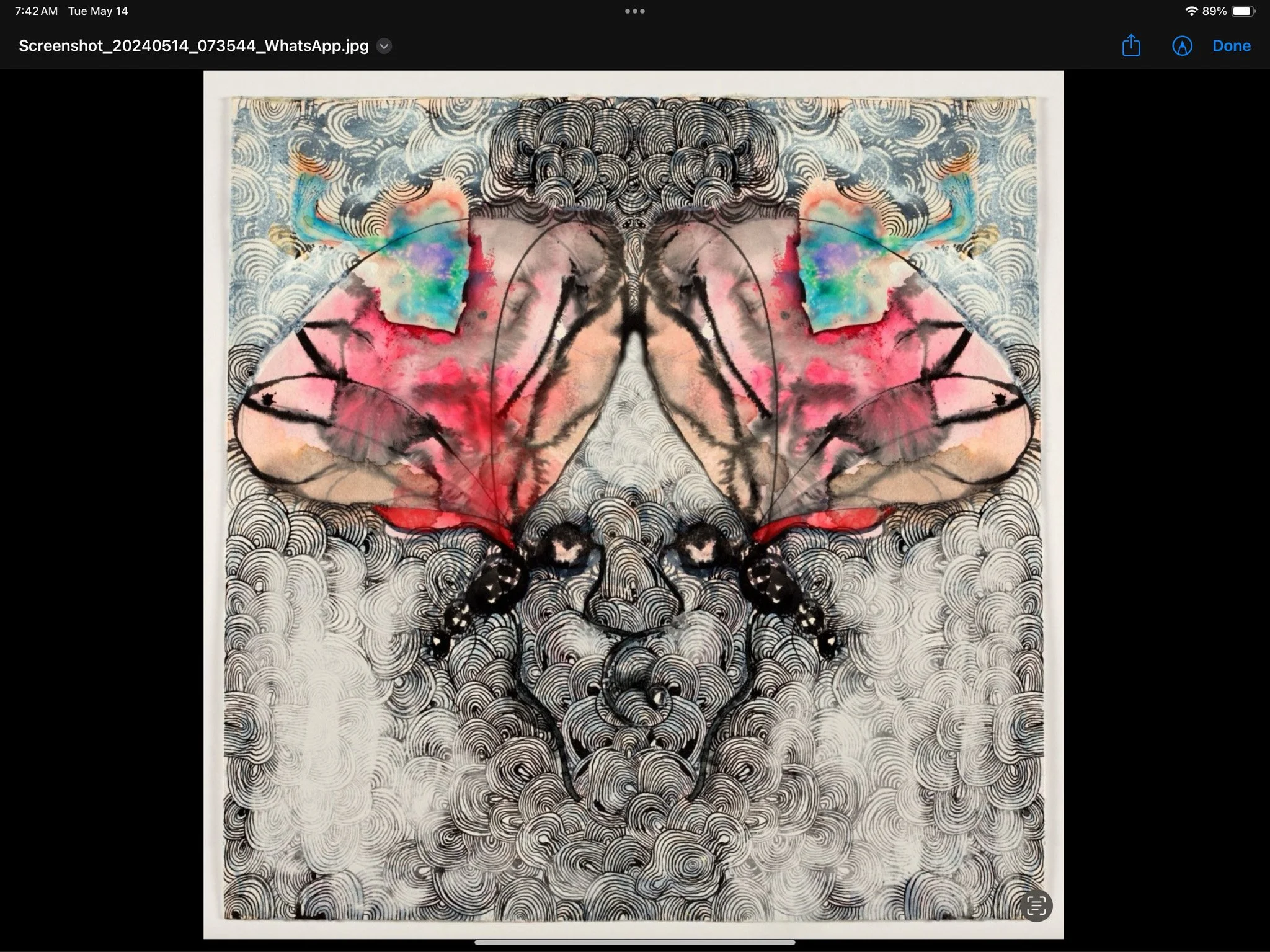 A symmetrical abstract artwork featuring a large, colorful butterfly with pink, red, and blue hues, set against a background of black and white swirling patterns.