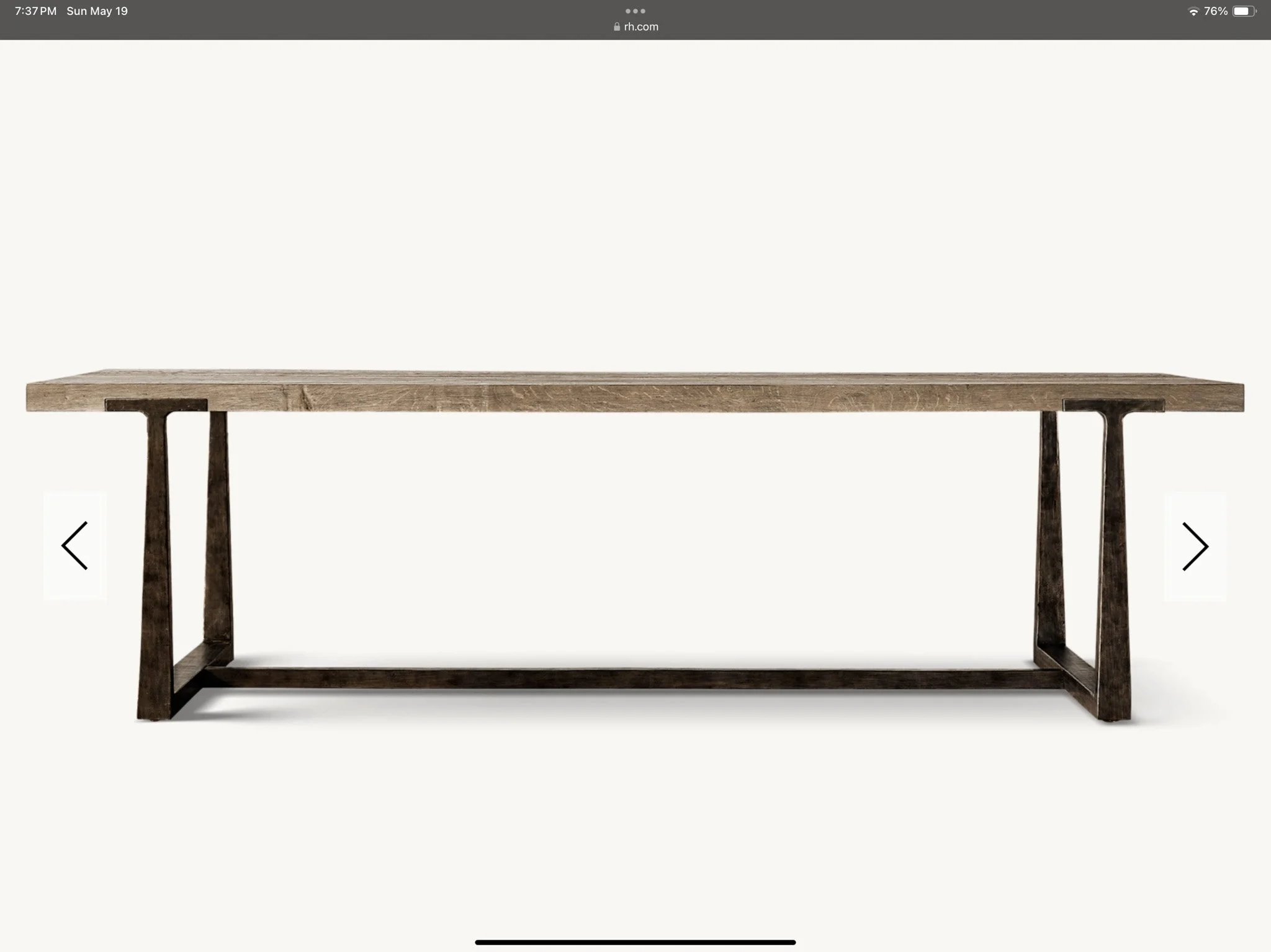 A wooden table with a rectangular top and a dark wooden frame base, set against a plain white background.