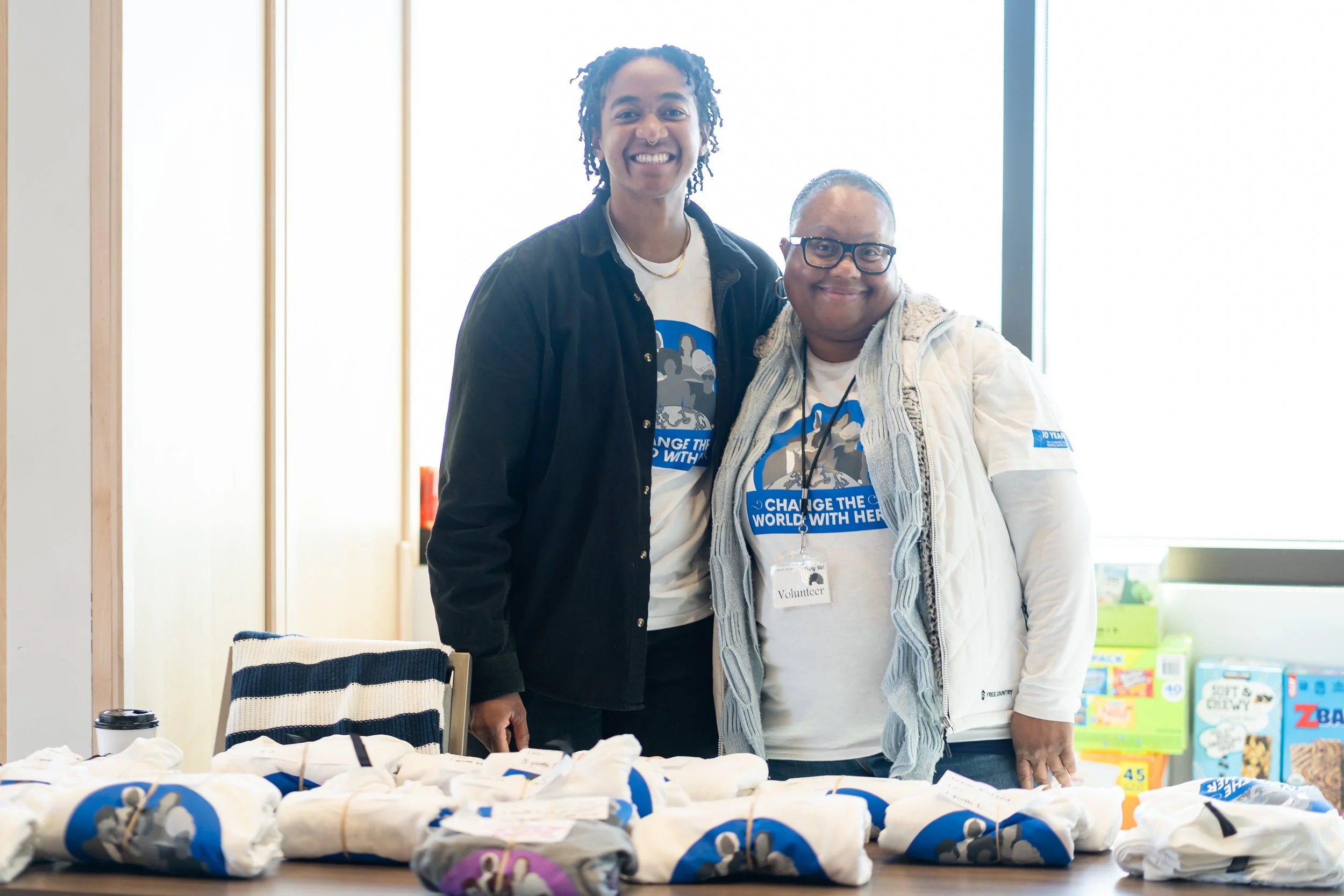 A photo of team member Chloe and volunteer at our 2026 Change The World With Her