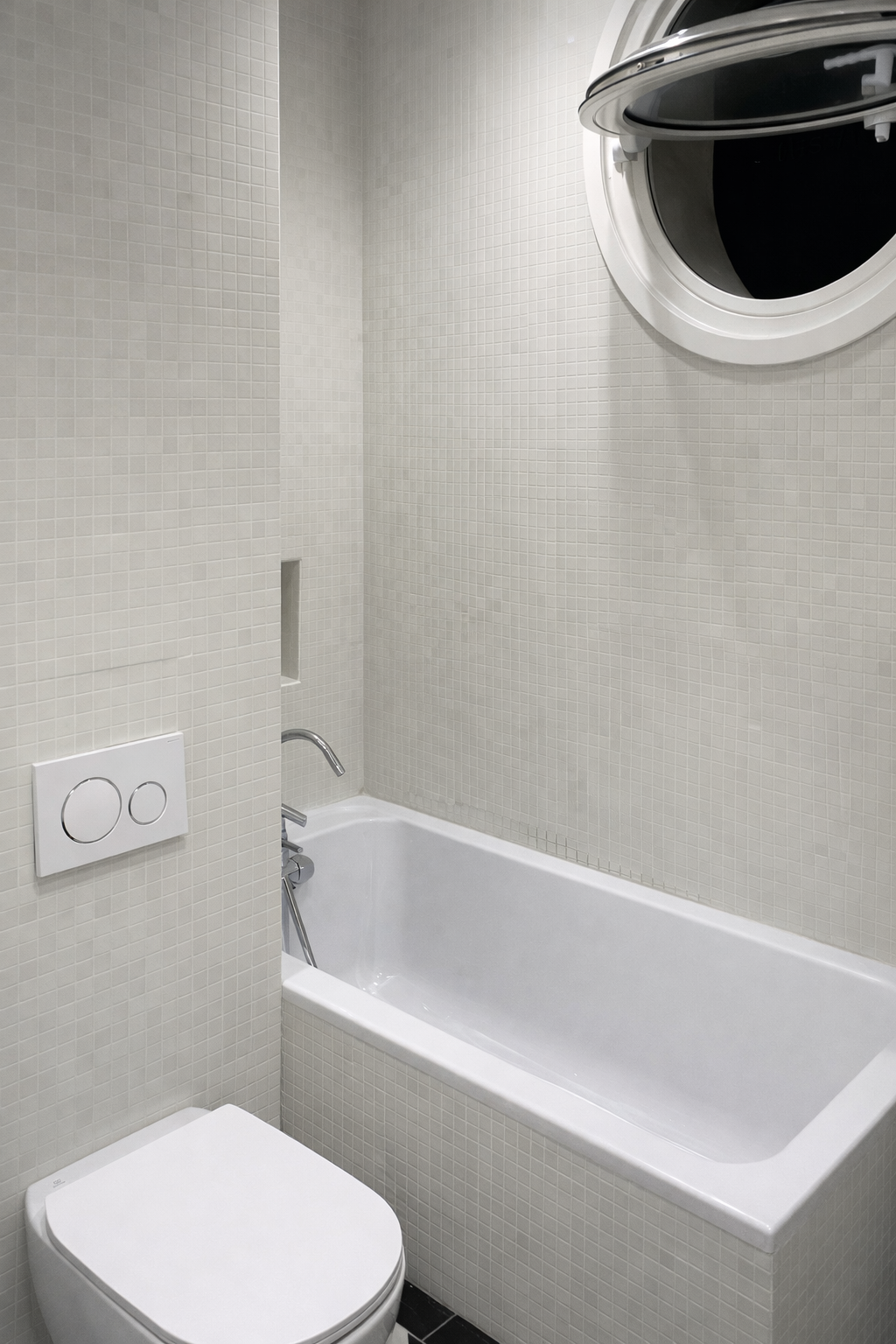 Modern bathroom with bathtub and toilet.png