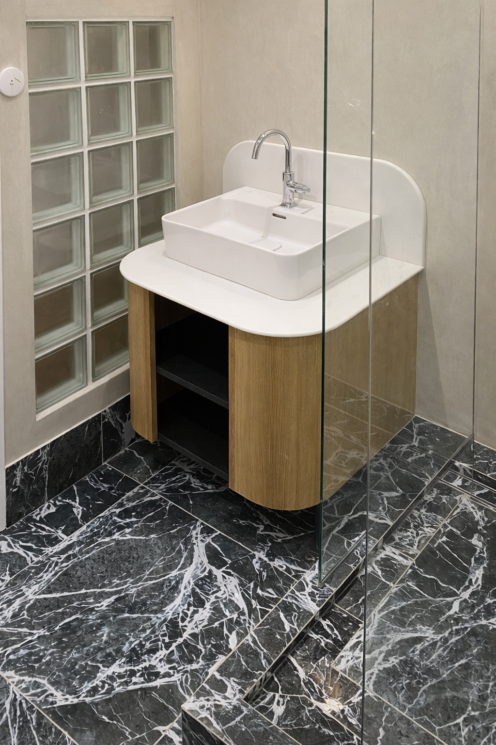 Modern bathroom with glass partition.png