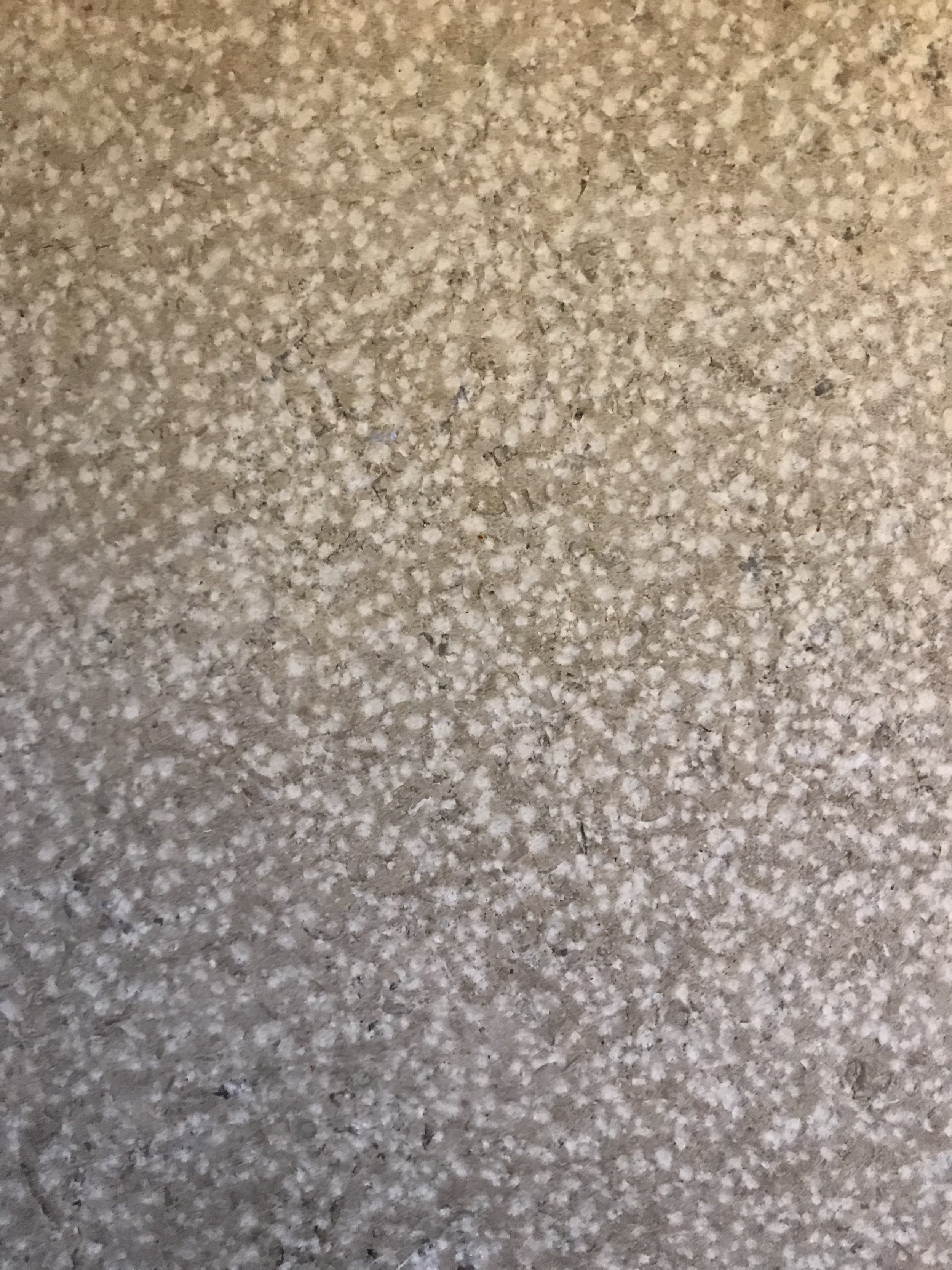 Close-up of a speckled galaxy grey granite countertop surface.