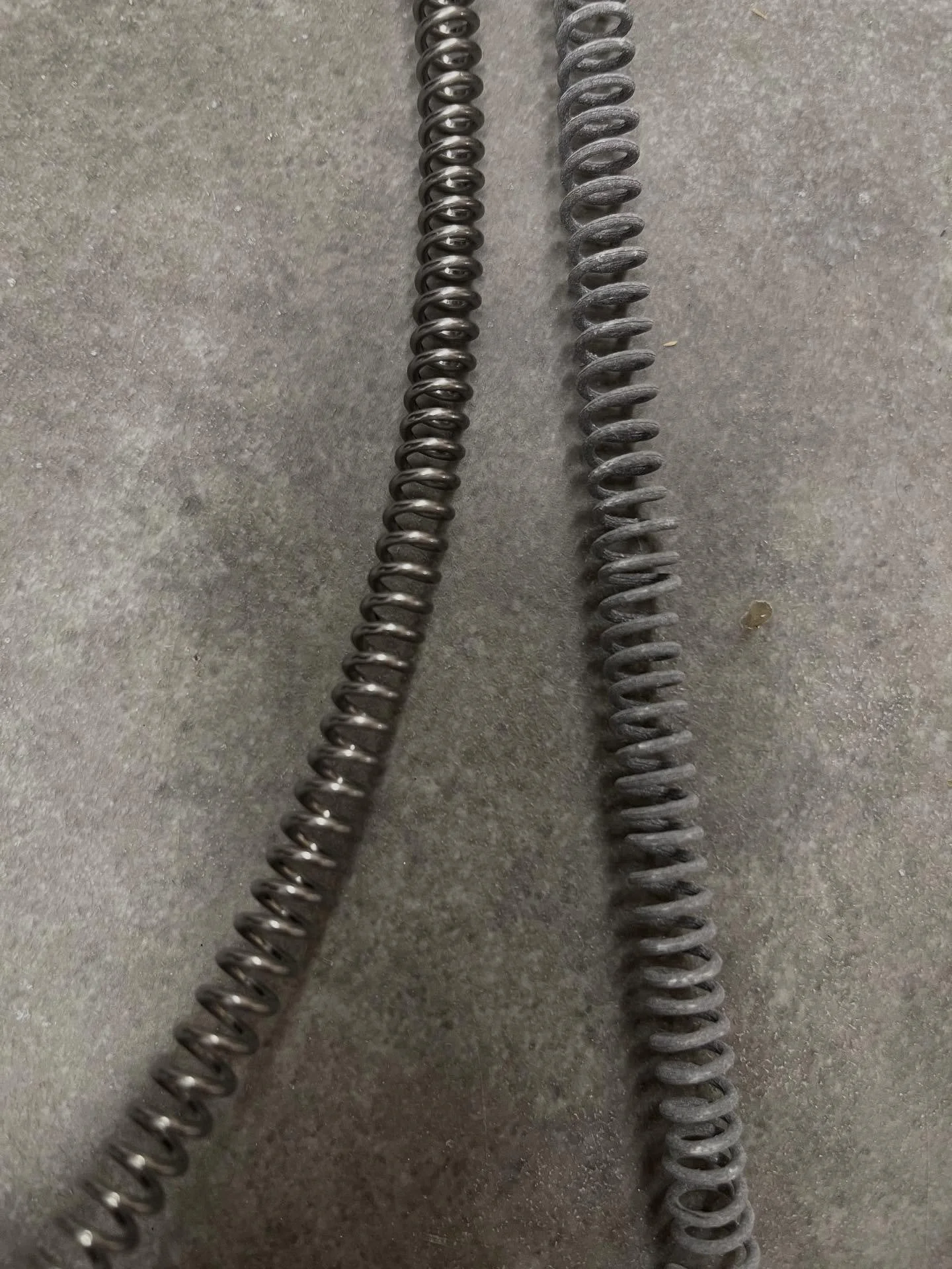 Shiny new kiln element on the left, old crusty kiln element on the right. I&rsquo;m replacing elements, relays, and my thermocouple.  There&rsquo;s about 250 firings on my kiln, and my last few glaze firings didn&rsquo;t quite make it to temperature.