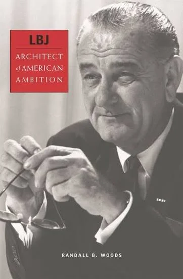 Book cover of "LBJ: Architect of American Ambition" by Randall B. Woods, featuring a black and white photograph of Lyndon B. Johnson with glasses in hand.