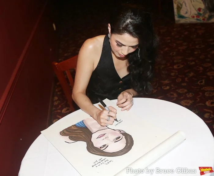 Arielle Jacobs signs autograph.jpeg