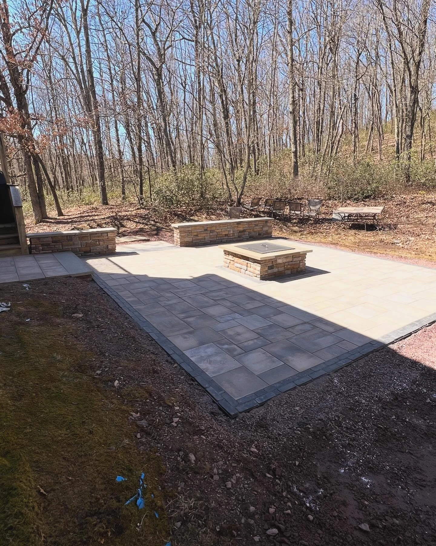 Worked through the cold temps in the mountains to get this project done 🏔️🥶. #unilockbeaconhill #unilockcopthorne #alliedlandscapesupply #outdoorliving #breeo #poconos #naturalstone #outdoorlighting