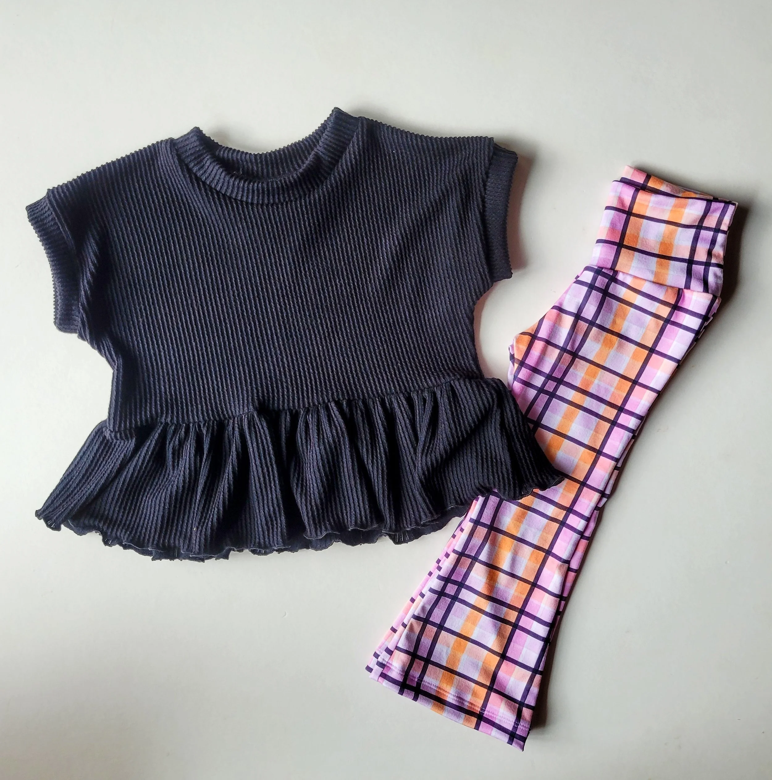 Black Rib Knit Ruffle Peplum + Plaid Flare Pants Set