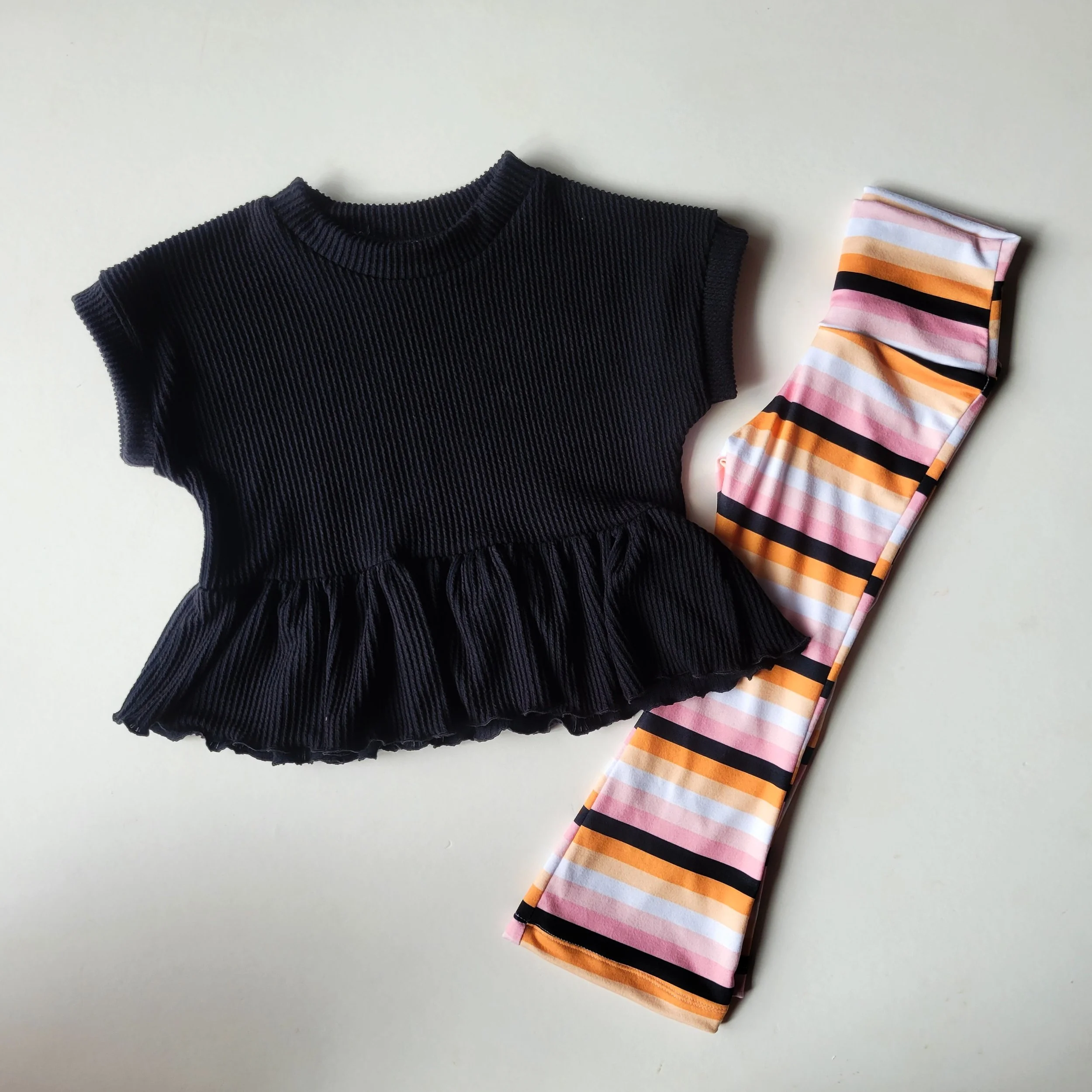 Black Rib Knit Ruffle Peplum + Stripe Flare Pants Set