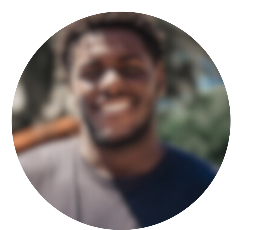Blurry image of a person smiling outdoors