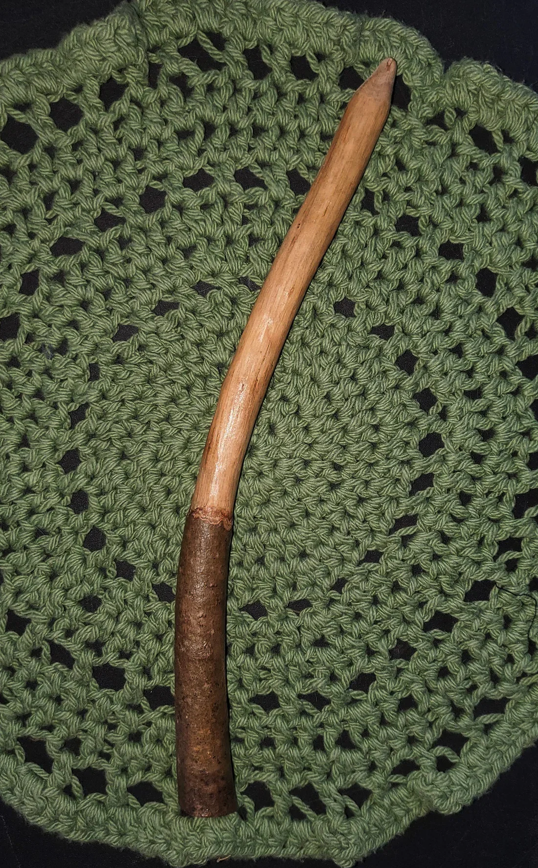 Wildwood Holler Wand #18, an Appalachian foraged wood ritual wand with a natural bark handle, smooth pale upper body, gentle curve, and pointed tip.