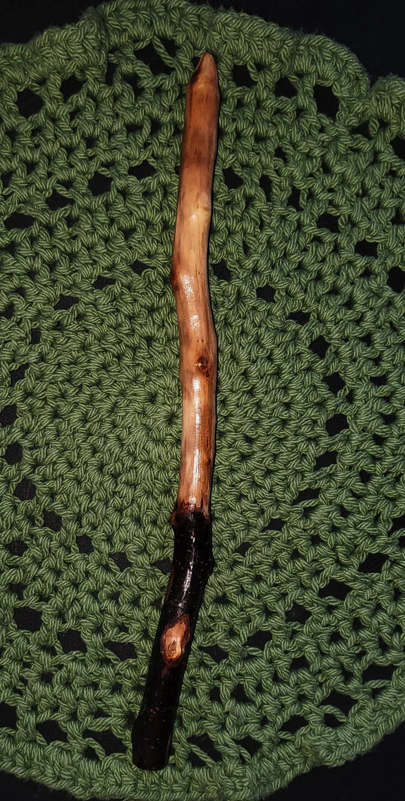 Wildwood Holler Wand #15, an Appalachian foraged wood ritual wand with a dark natural handle, warm polished upper body, gentle curve, and pointed tip.