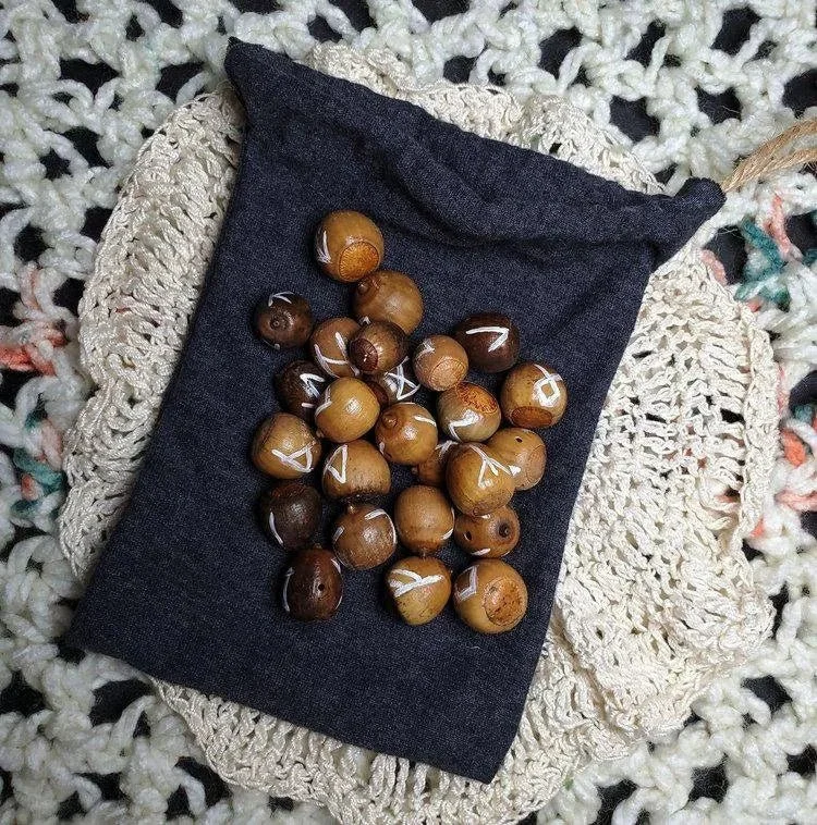 Foraged Appalachian acorn rune set for Elder Futhark divination, rune casting, altar work, and spiritual guidance
