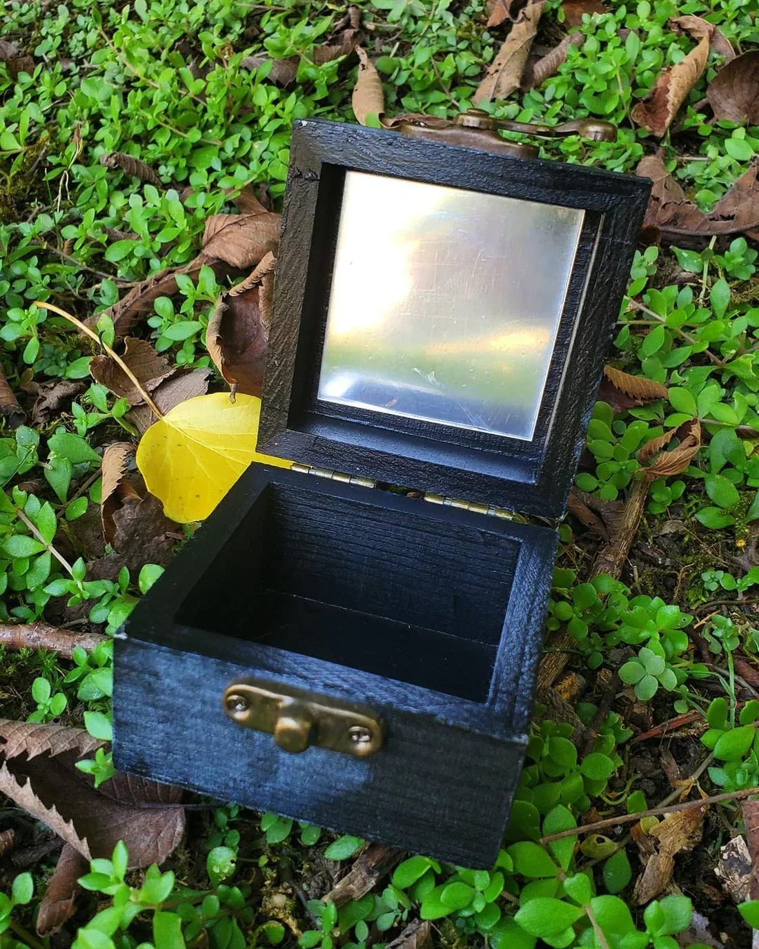 Small wooden mirror spell box with hand-painted design for manifestation, reflection magic, and intention work