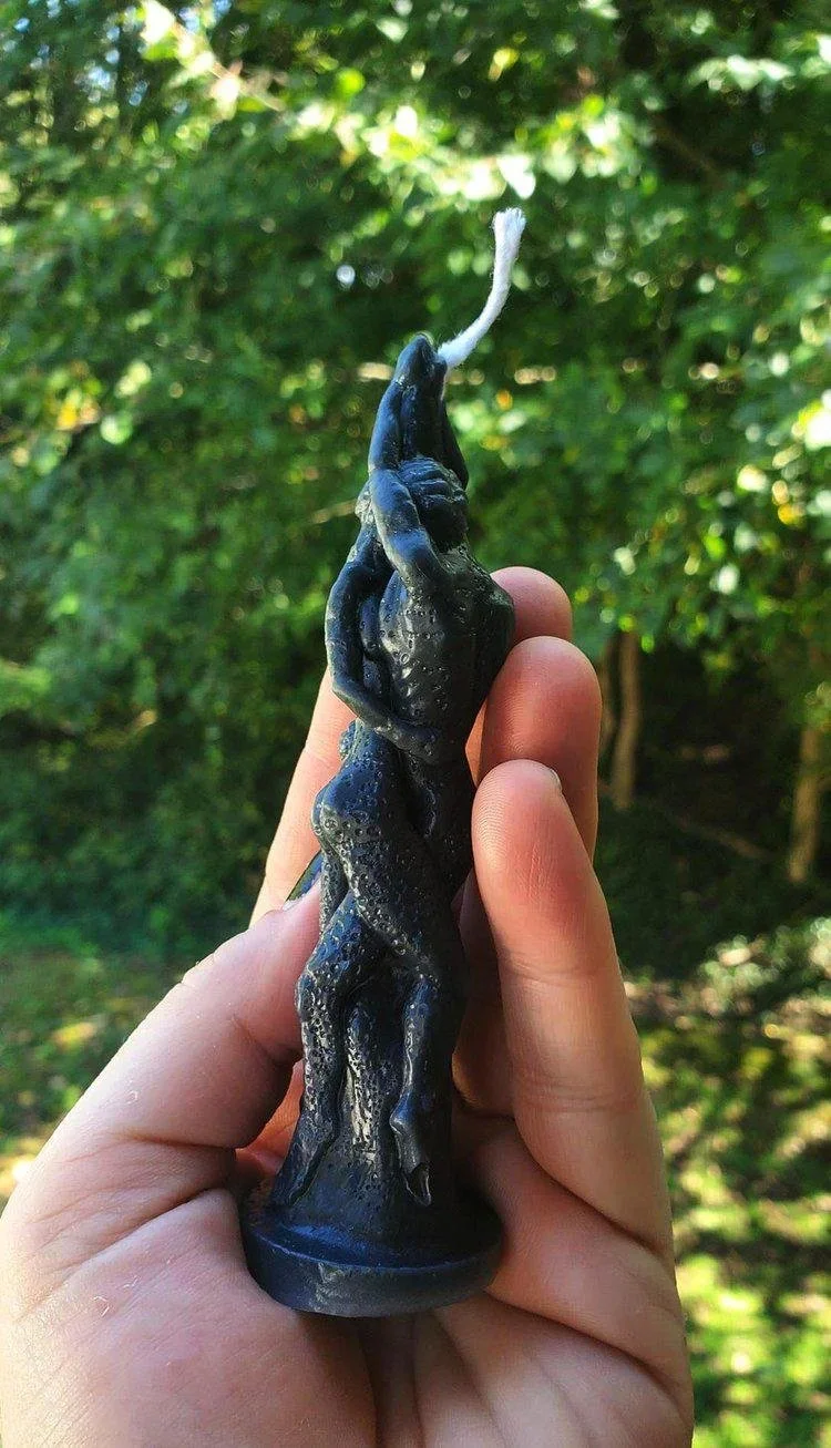 Hand-poured intertwined lovers figure candle for love and connection work.
