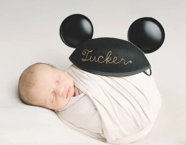 "You're never too young to wish upon a star… or wear a pair of mouse ears."
Welcome to the world, Tucker—where dreams begin early and magic fits just right. This little one reminds us that the sweetest adventures often start with the tiniest dreamers