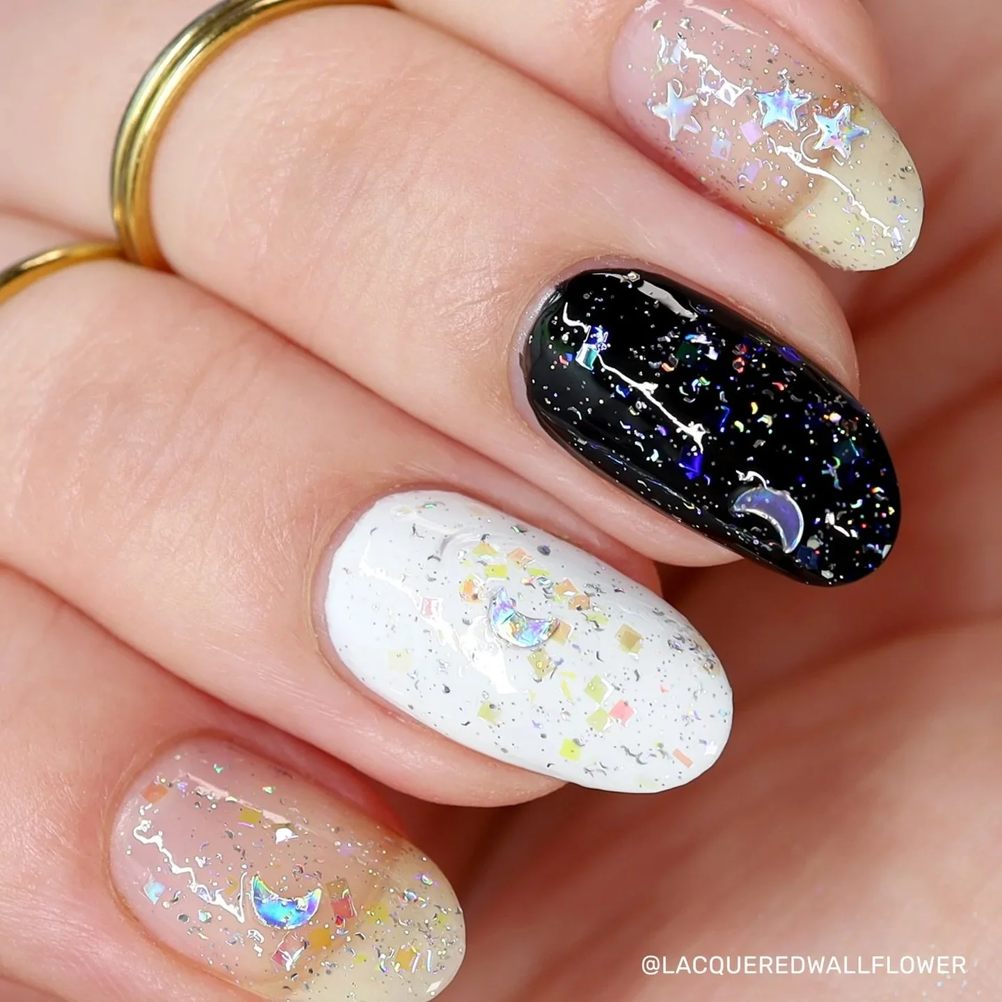 STARGAZING (topper)
Silver holo moons, stars, silver holo glitter &amp; shreds, &amp; iridescent square glitter in a glitter suspension base.

Swatched by @lacqueredwallflower @tonyaispolished @mreads.nails @eviltwinnails 
Paid PR

#fauvecosmetics #n